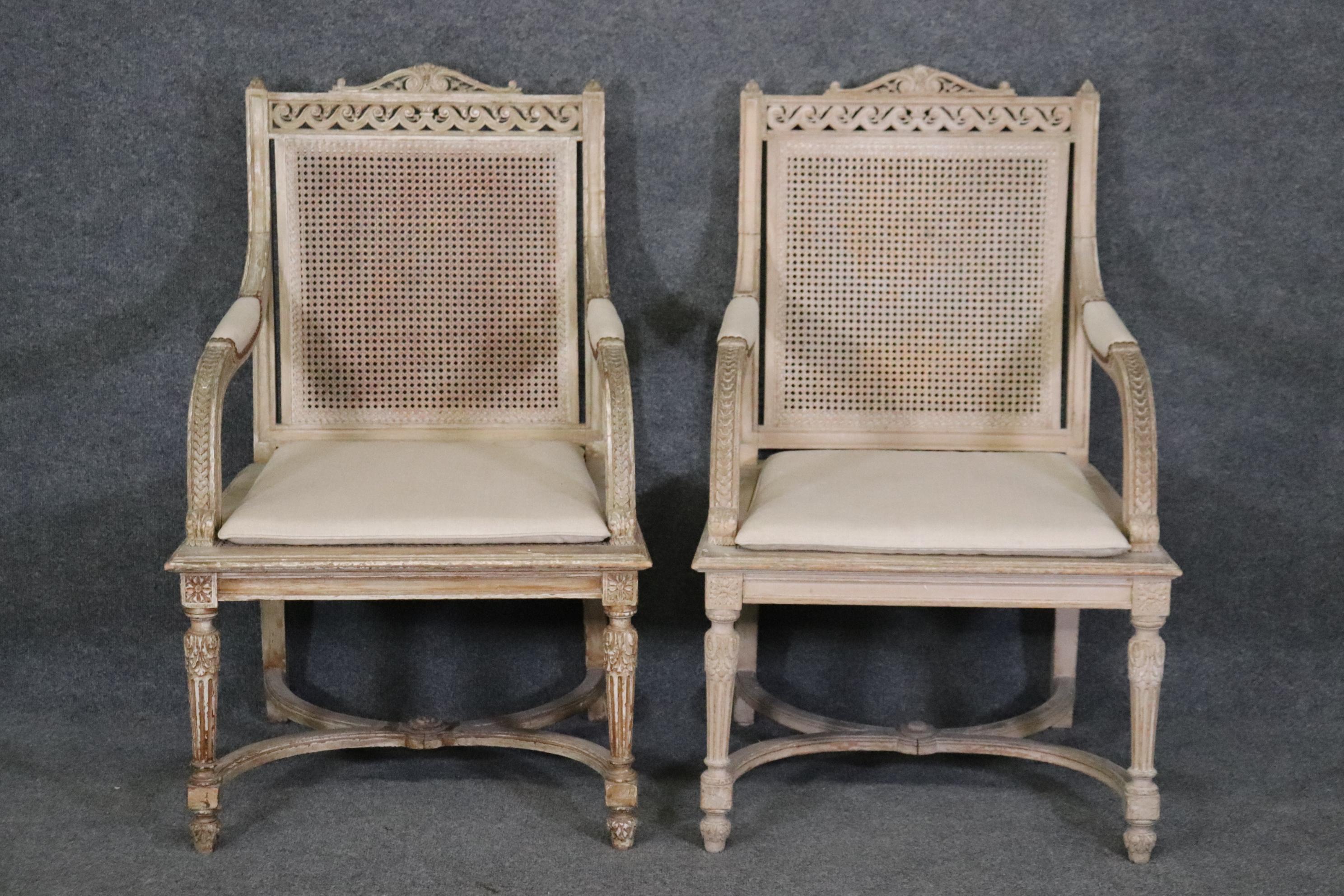 Mid-20th Century   Pair of Cane Back Antique White Paint Decorated Louis XVI Style Armchairs Dini For Sale