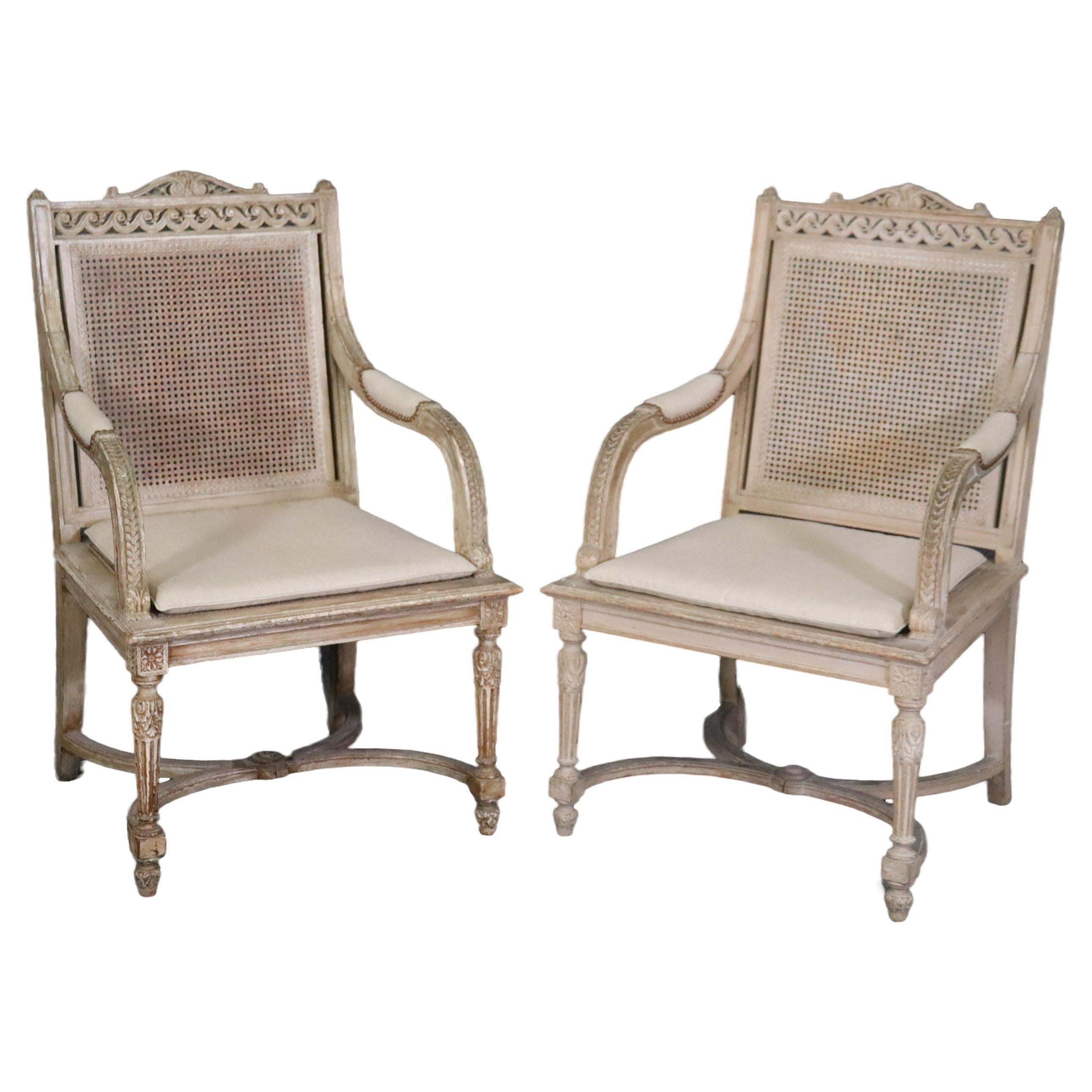   Pair of Cane Back Antique White Paint Decorated Louis XVI Style Armchairs Dini For Sale