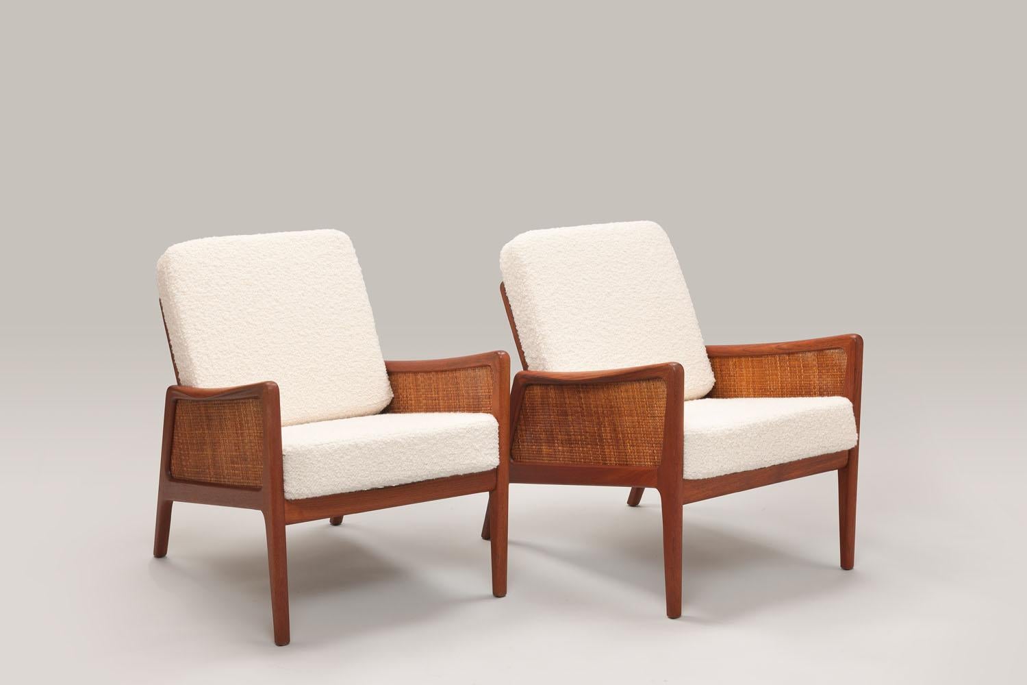 These lounge chairs were designed in 1956 by Danish designers Peter Hvidt and Orla Mølgaard-Nielsen. This designer duo has stood side by side for over 30 years, producing many famous and intrinsic designs. Amongst this lesser known chair model