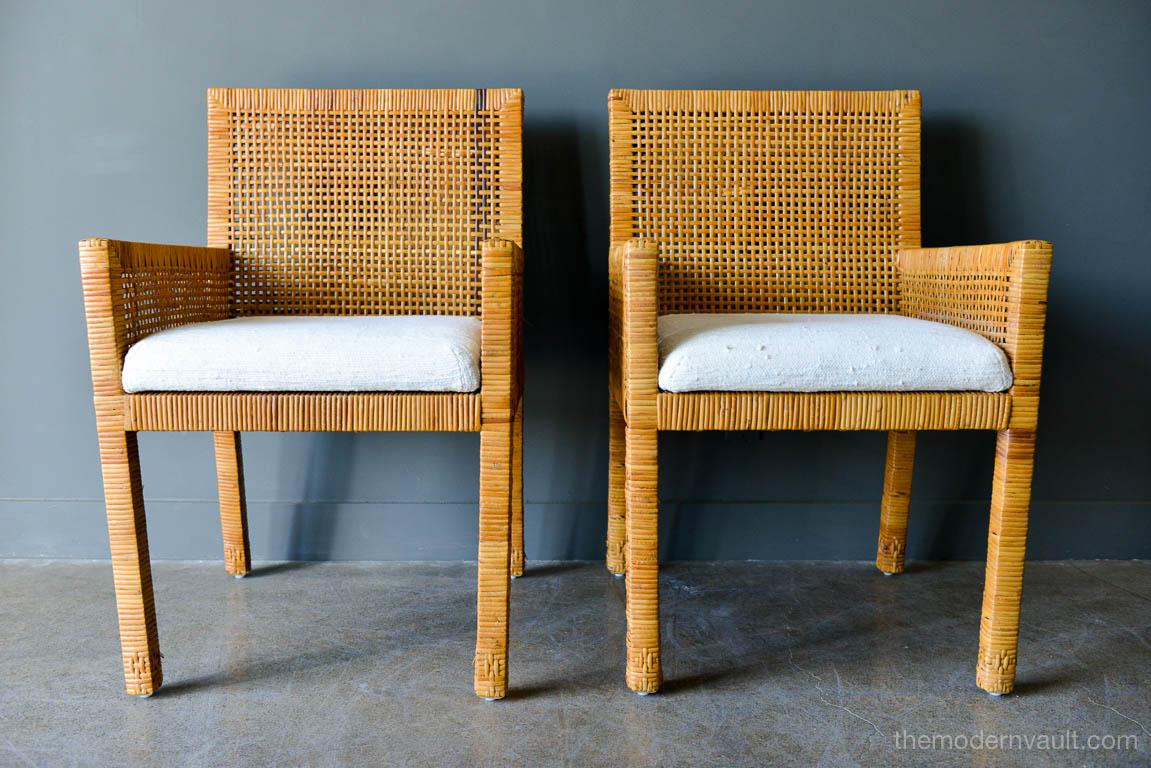 Pair of cane wrapped armchairs in the style of Billy Baldwin, circa 1970. Original silk cushions, bottom cushion is attached, back cushion is floating. Beautiful design, very comfortable chairs with great leg detail. Cane is in very good vintage