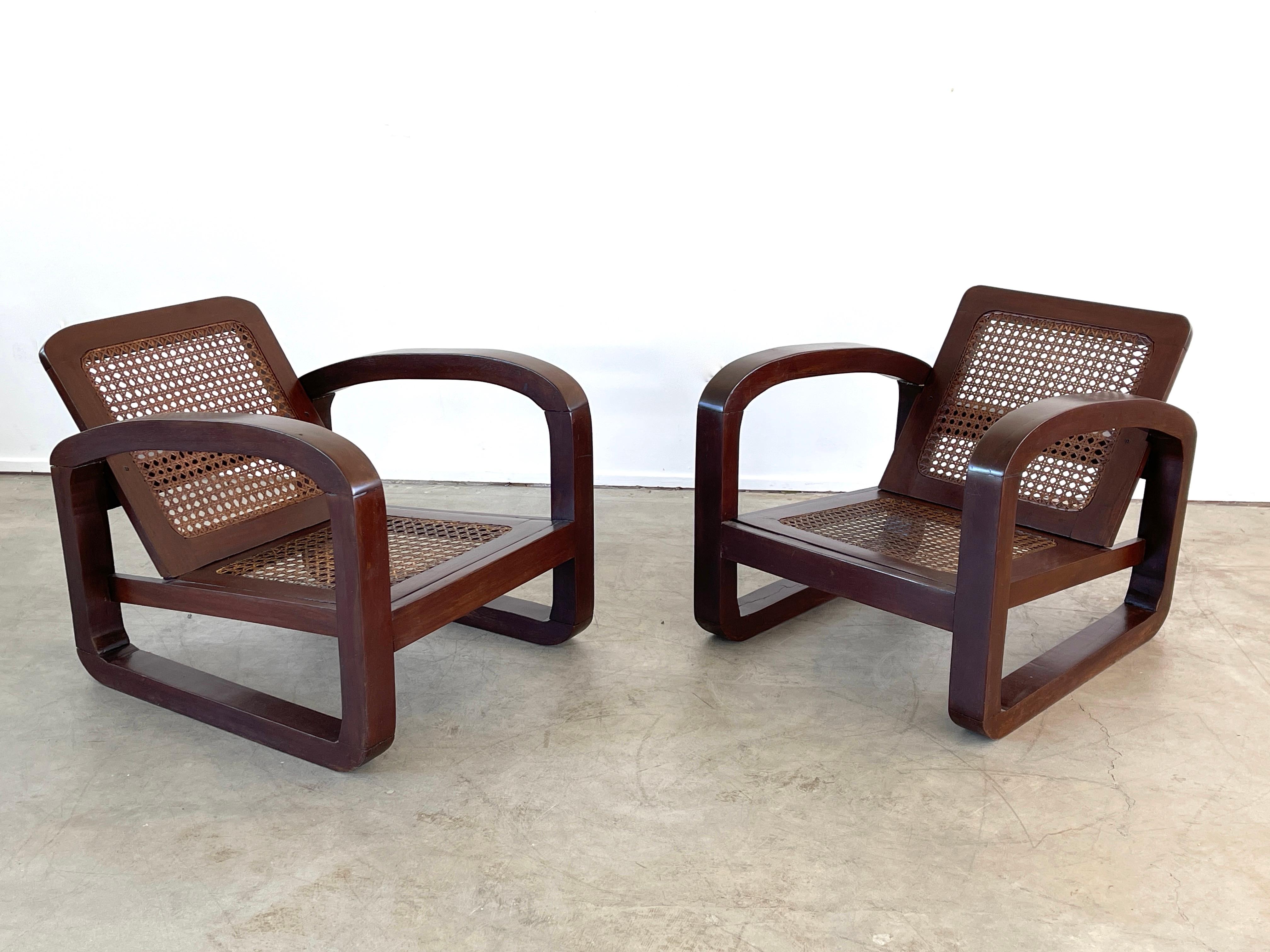 Pair of French Loop shaped armchairs with wonderful patina and original caning. 
France, circa 1950s.