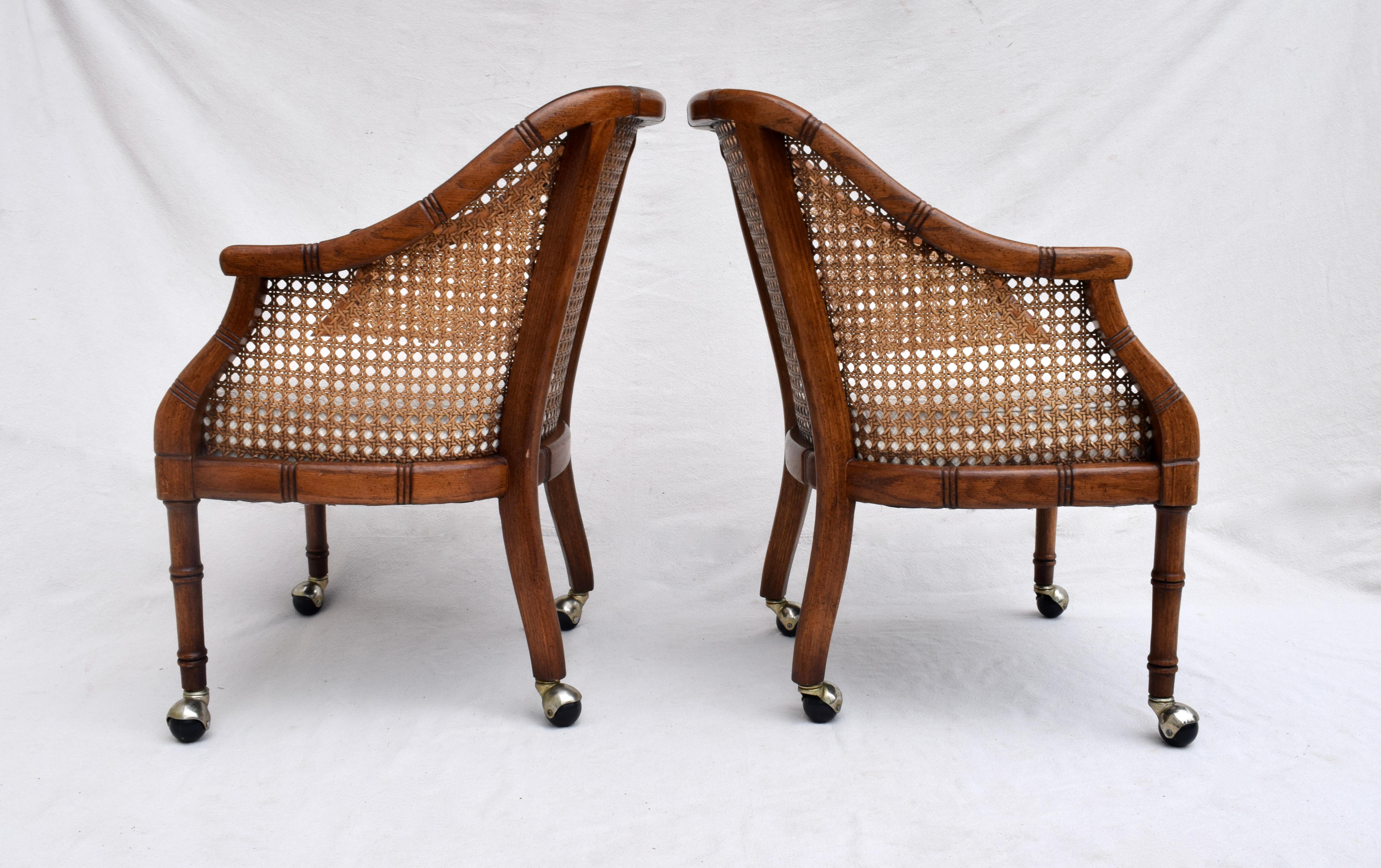 Exceptional pair of Mid-Century Modern barrel chairs in the manner of Harvey Probber featuring faux-bamboo wooden frames on casters with caned backs and sides. New custom stationary seats are upholstered in hand loomed & textured cotton tapestry