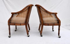 Pair of Caned Barrel Chairs on Casters