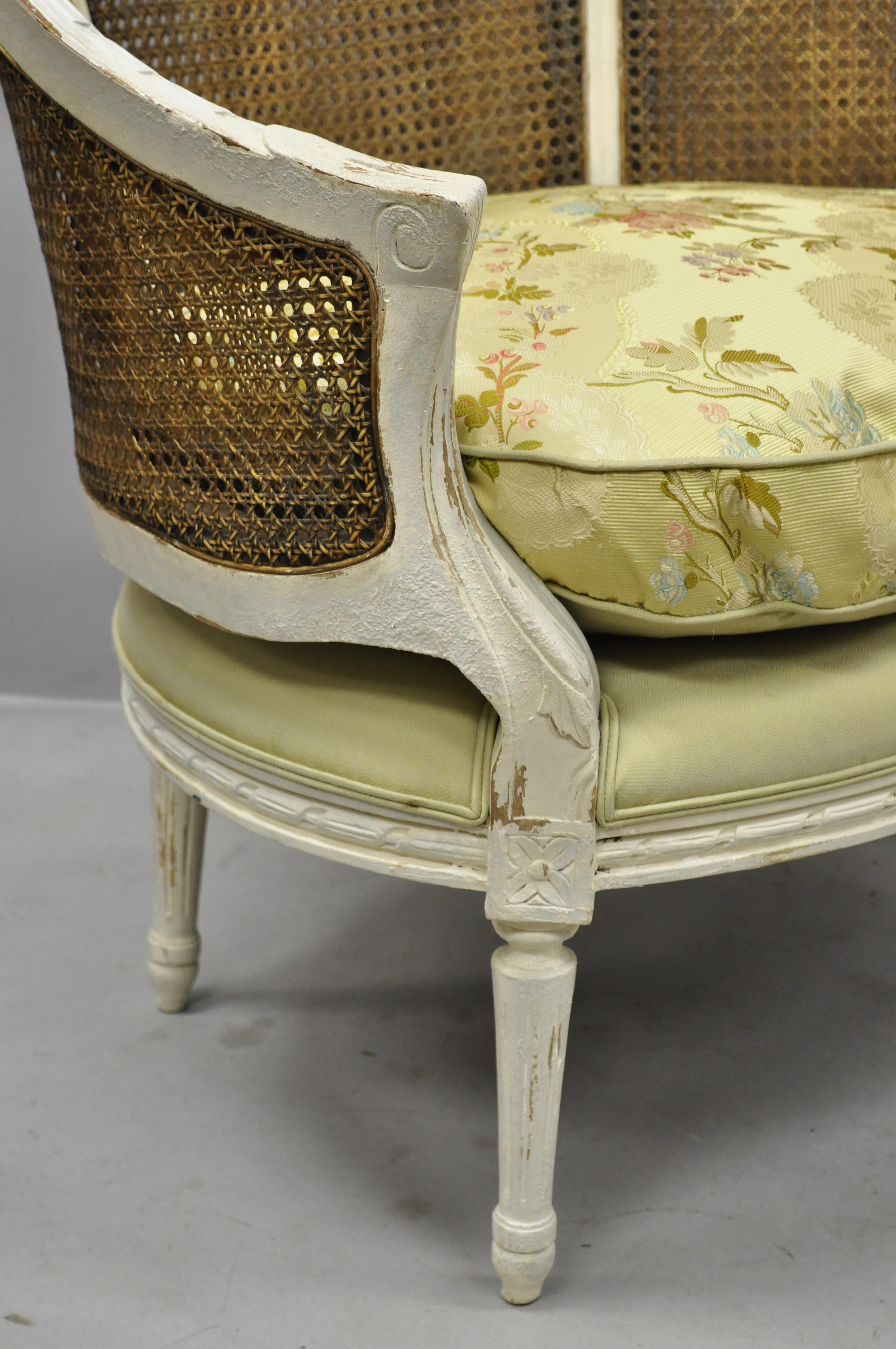 Pair of Caned French Louis XVI Style White Distress Painted Bergere Salon Chairs For Sale 1