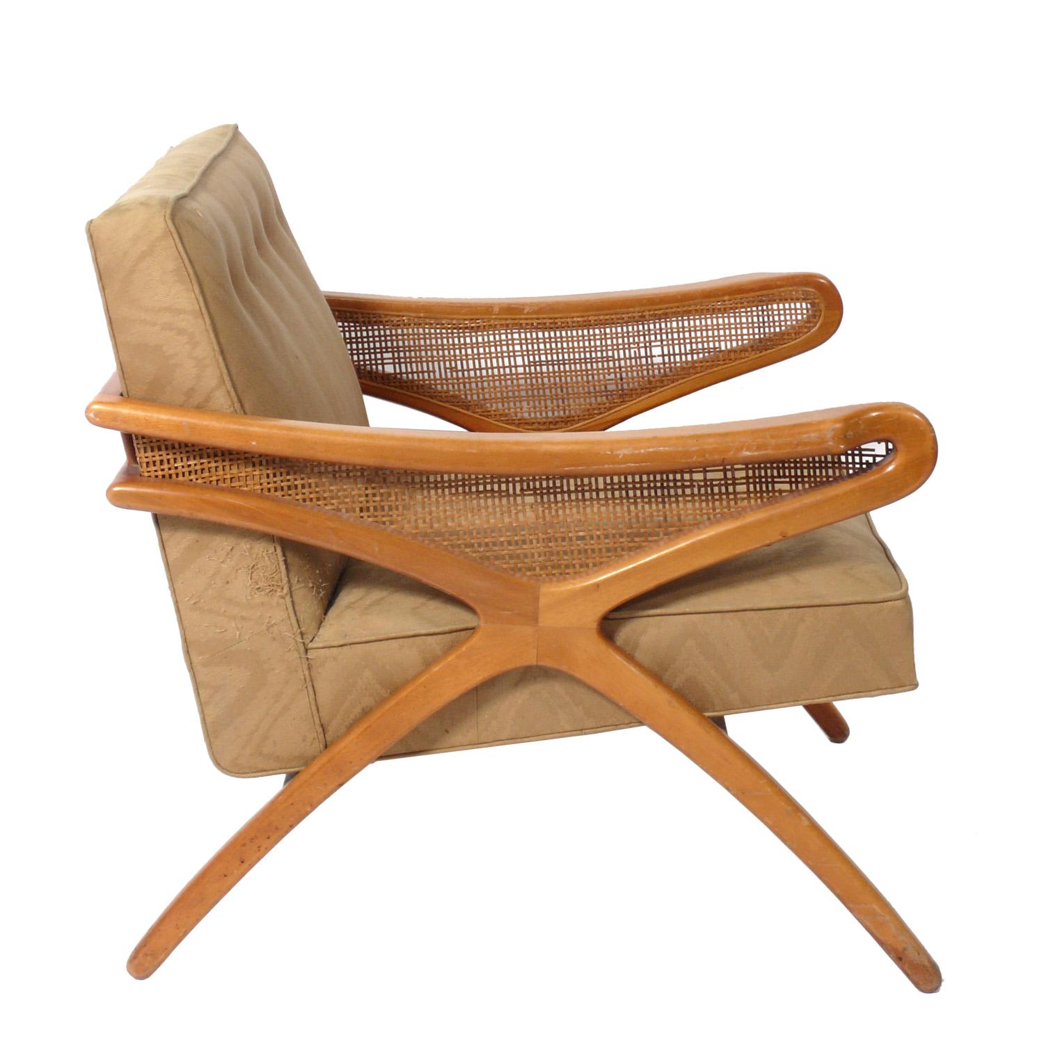 Pair of caned mid century lounge chairs, American, circa 1960s. These chairs are being completely restored. The price noted includes refinishing in your choice of color and reupholstery in your fabric. Simply send us 8 yards of your fabric after