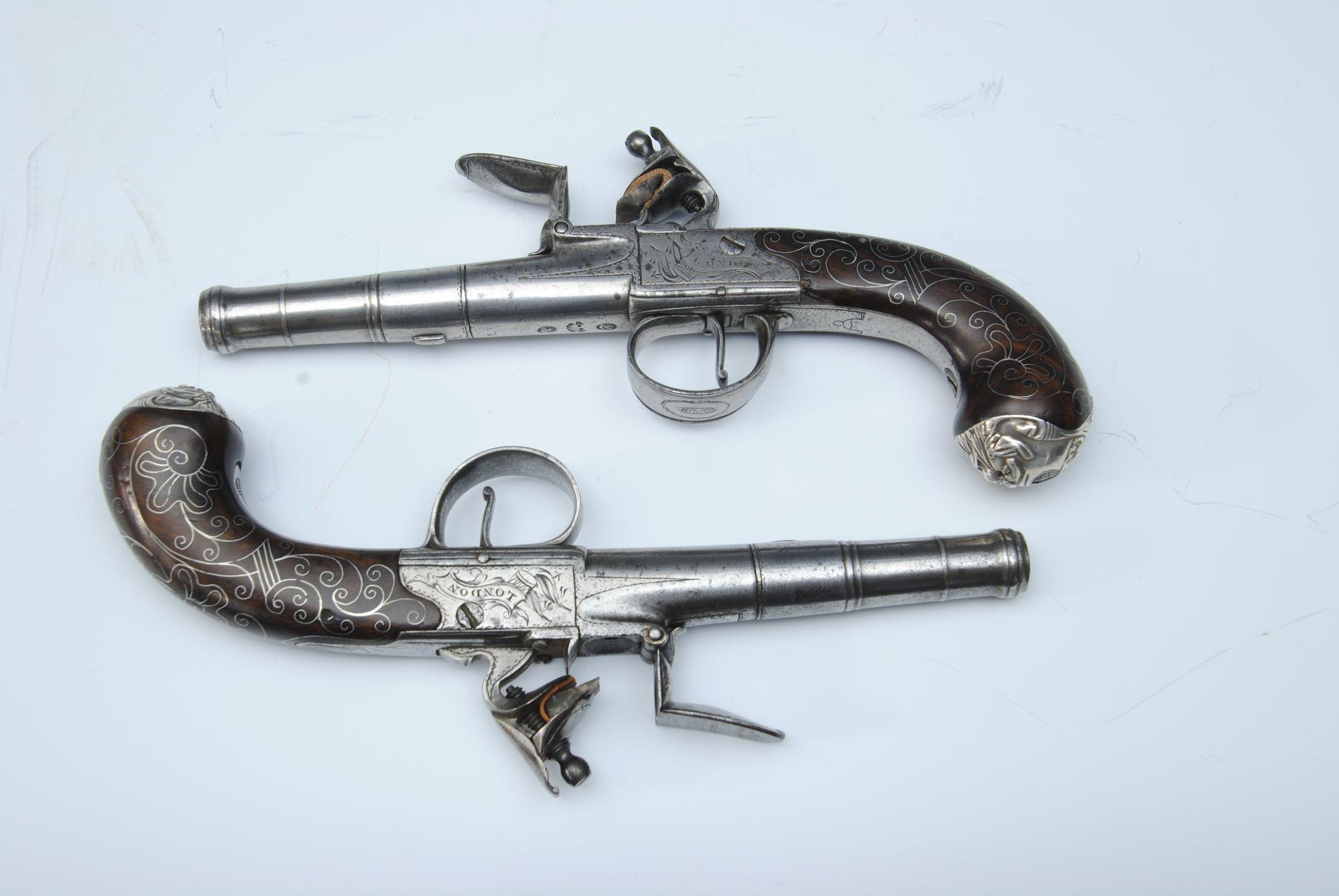 A pair of 18th century 50-bore turn-off cannon barrel pistols by Turvey, London with silver butt mounts and wire inlays.
Barrel length 8 cm