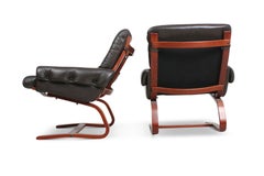 Pair of cantilevered leather lounge chairs by ingmar relling