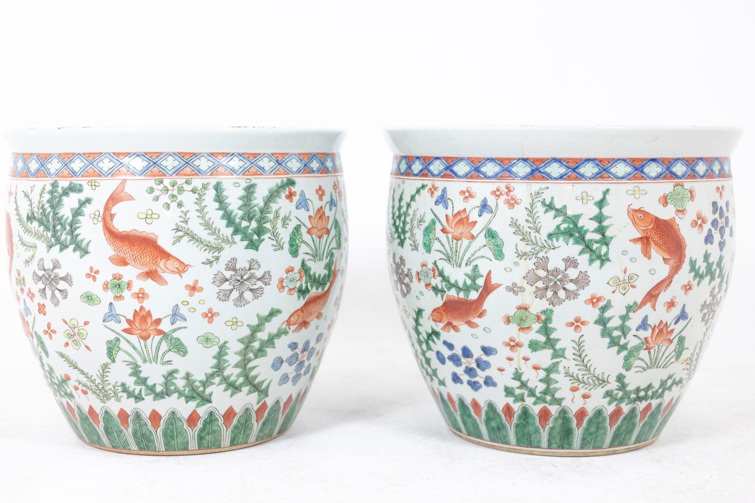 Pair of Canton porcelain planters, circular in shape, decorated with koi carp.

Work realized circa 1950.