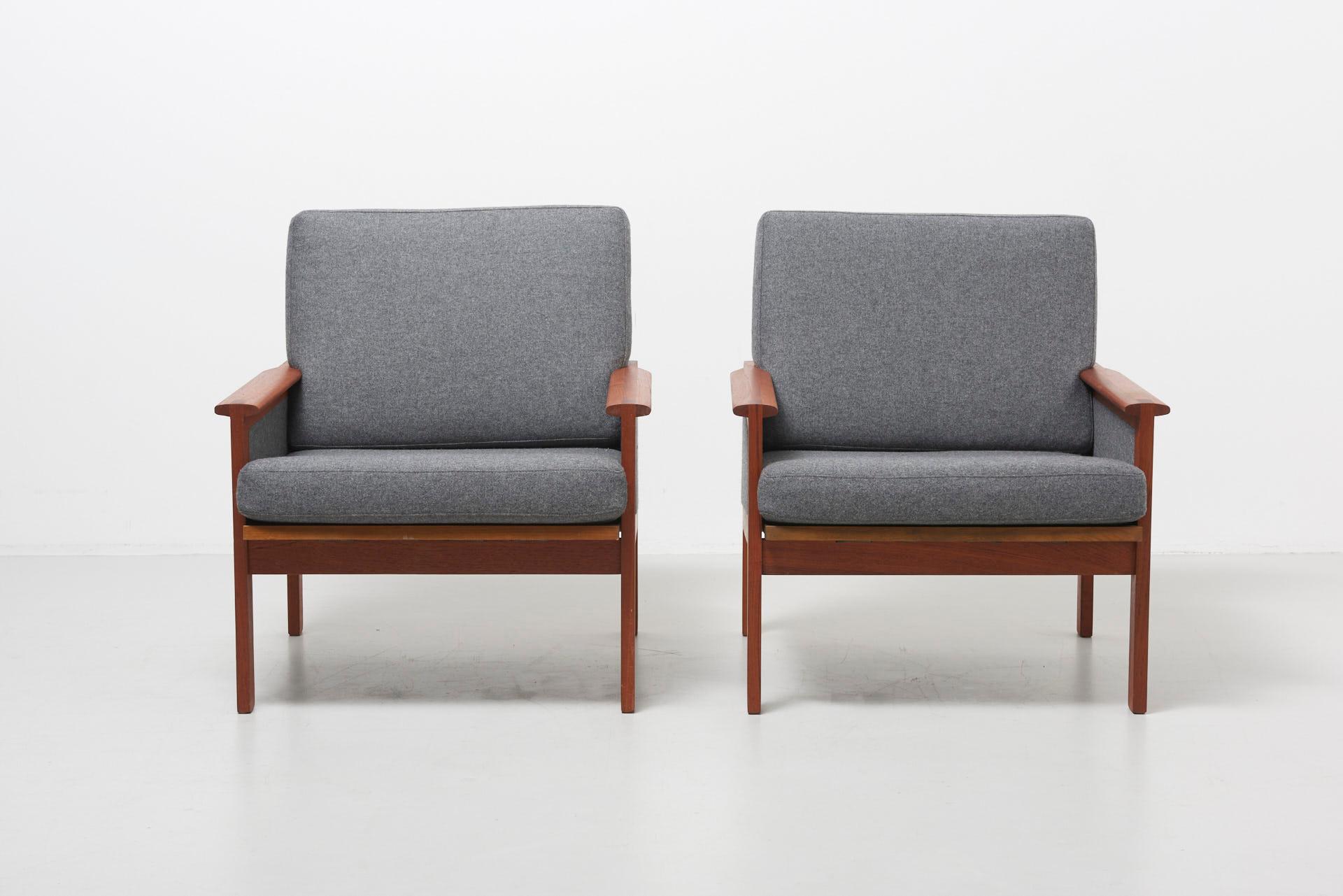 A pair of n°4 lounge chairs of the Capella series. A teak frame with new upholstery in a grey fabric. Design by Illum Wikkelsø in 1959. Produced by N. Eilersen.