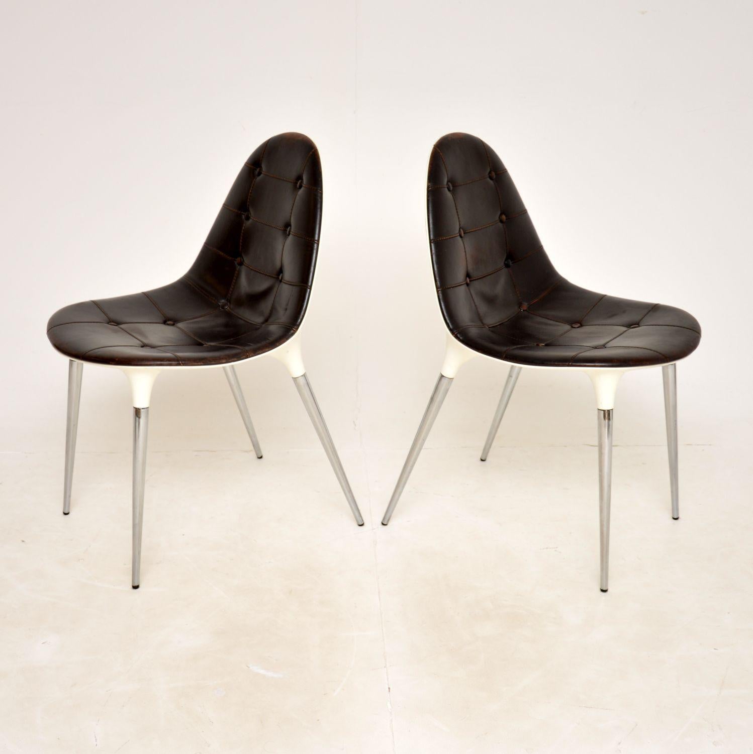 A stunning pair of modernist chairs with a retro / space age feel. This model is called the Caprice chair, they were designed by Philippe Starck in 2007 and made in Italy by Cassina.

They seat on chrome plated steel legs, with white nylon shell