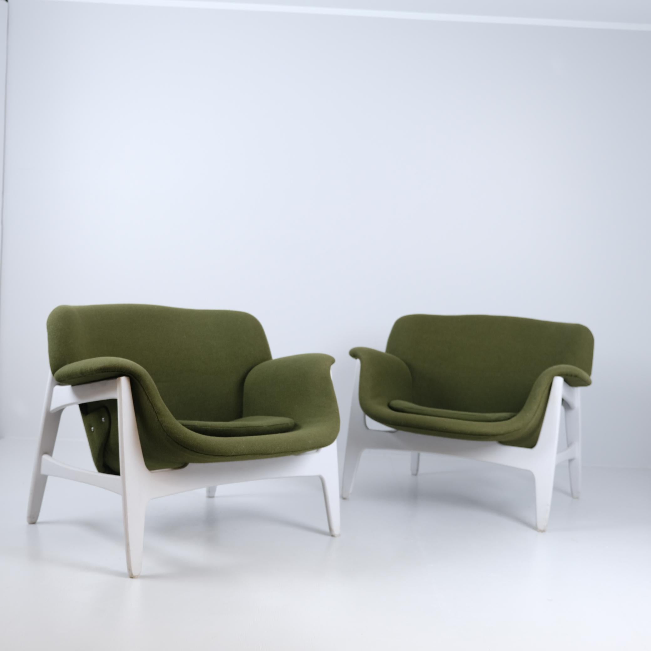 A pair of elegant armchairs designed by Carin Bryggman for Boman Oy in Finland in the 1950s-1960s.  The chair bodies are in original and very good condition. The upholstery has been changed at some point.

The chairs are compact in size compared to