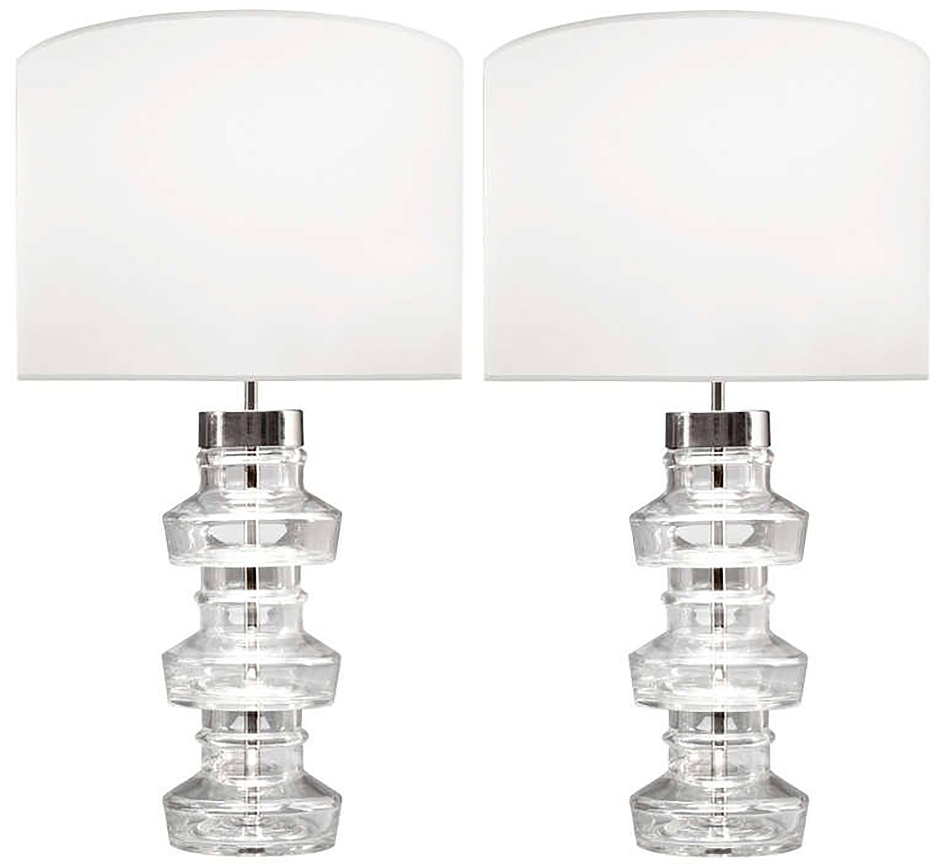 A pair of  clear glass lamps with polished nickel hardware by Carl Fagerlund for Orrefors. 

Swedish Circa 1960's

In Stock

Lamp Shades Are Not Included.

If you are interested in Lamp Shades, please email The Craig Van Den Brulle Design Team Via