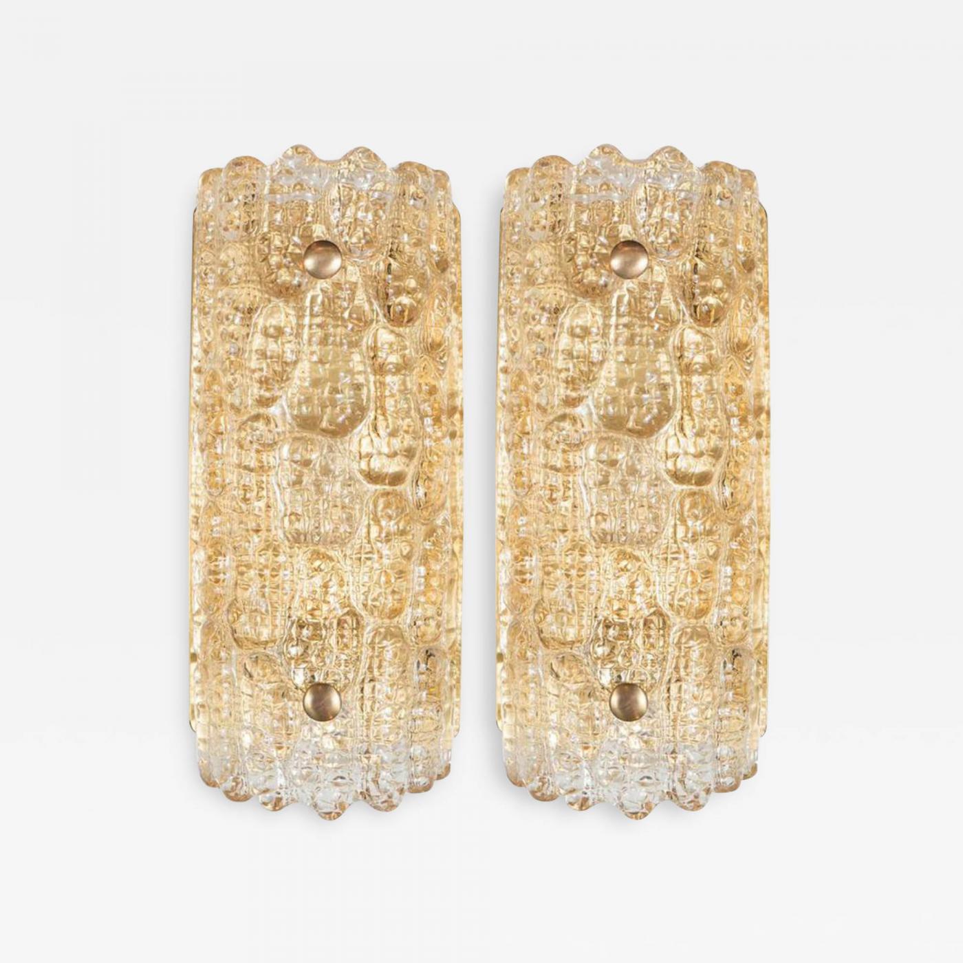 Pair of shield form crystal sconces with a stylized embossed crocodile pattern on satin brass frames. Professionally rewired for use in the USA.