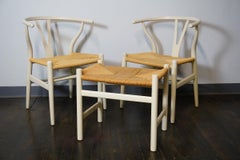 Pair of Carl Hansen Wishbone Chairs and One Ottoman Off-White Frames