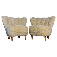 Pair of Carl-Johan Boman Lounge Chairs in Sheepskin, Finland, 1940s