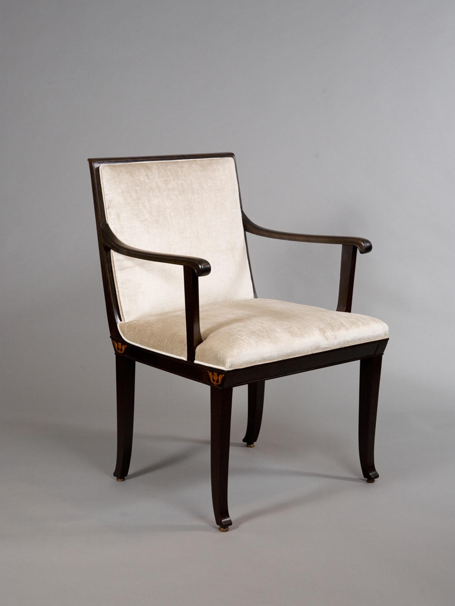 Pair of open armchairs with marquetry inlay accents designed by Carl Malmsten (1888-1972). Fully restored and newly upholstered. Seat depth - 17.5