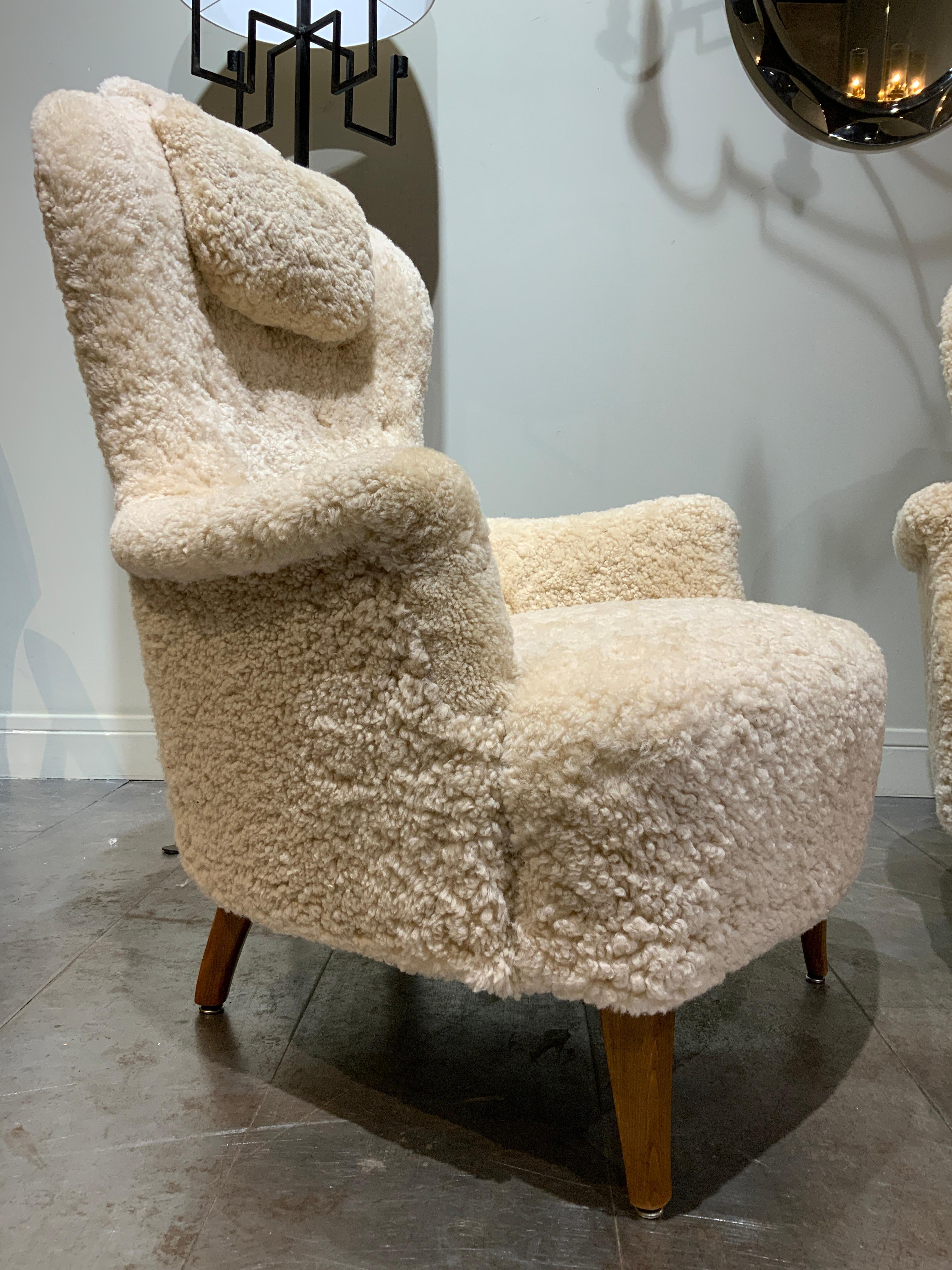 Very elegant and confortable pair of Carl Malmsten « Farmor » newly upholstered in sheepskin 
Produced by O.H. Sjogren in Tranas Sweden 1950