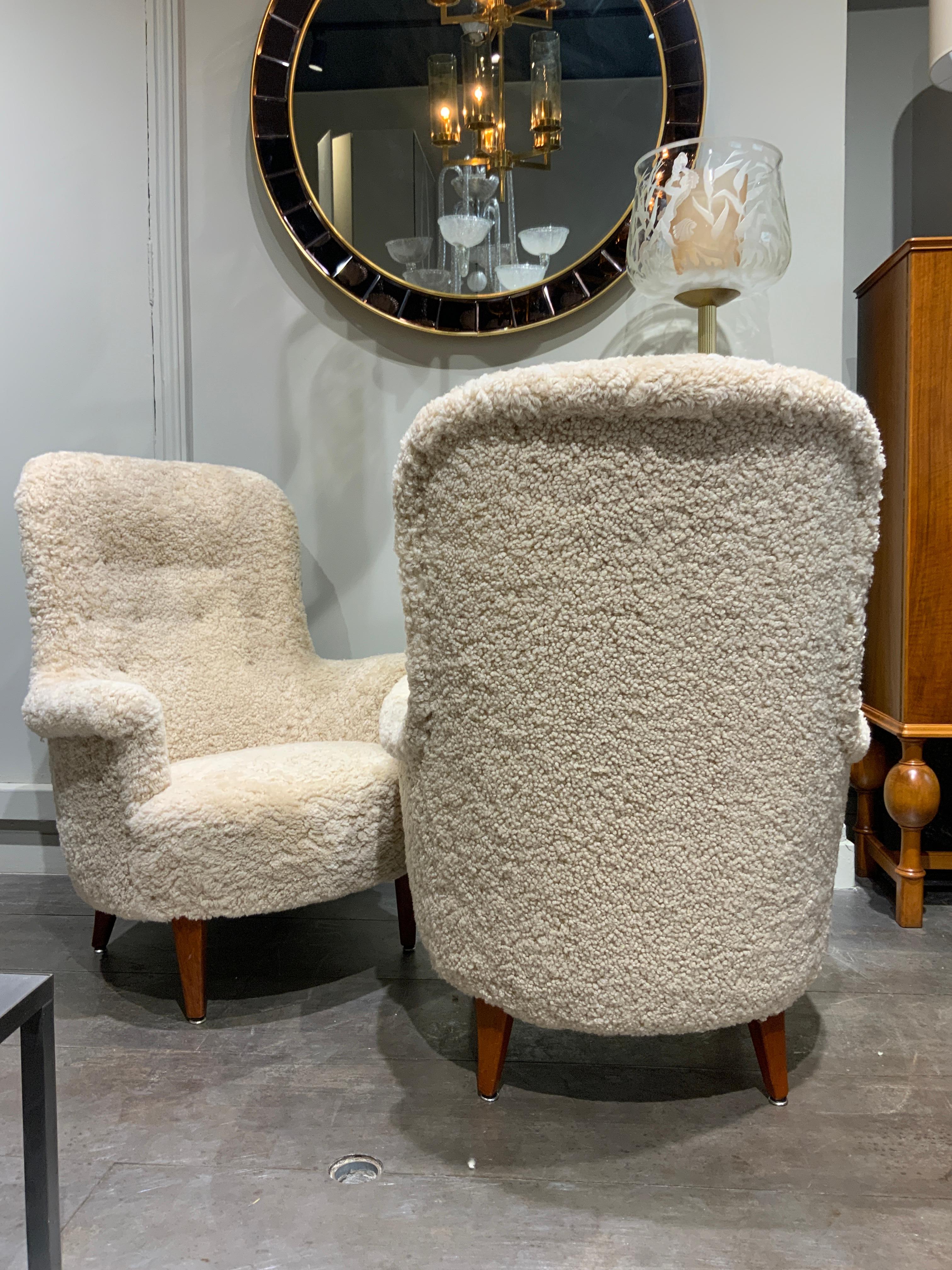 Elegant pair of Carl Malmsten marked newly upholstered in sheepskin 
Sweden 1960 
