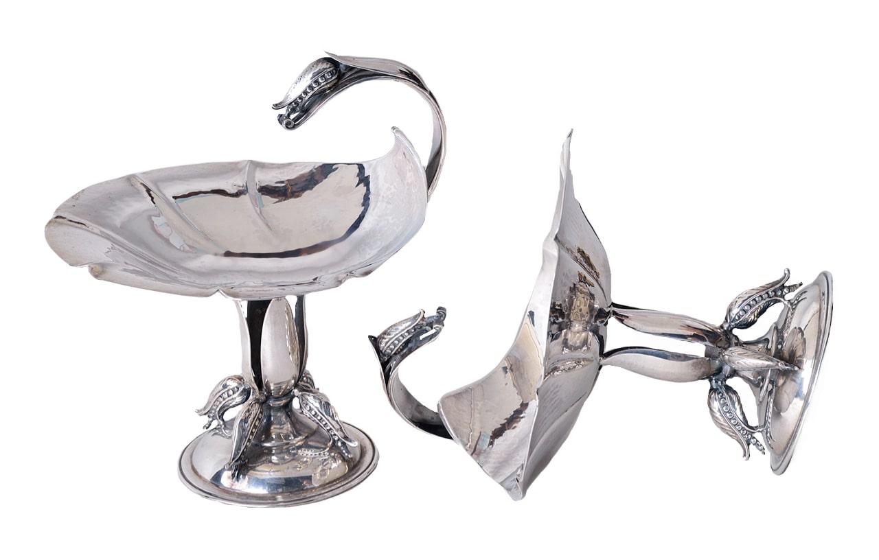 A pair of Canadian sterling silver footed bonbonnières by Carl Poul Petersen Hammered shallow plate with knurled edges and scrolling handle with pea pod design Stem composed of leaves with four pea pods on a circular base Marked «PP Hand Made