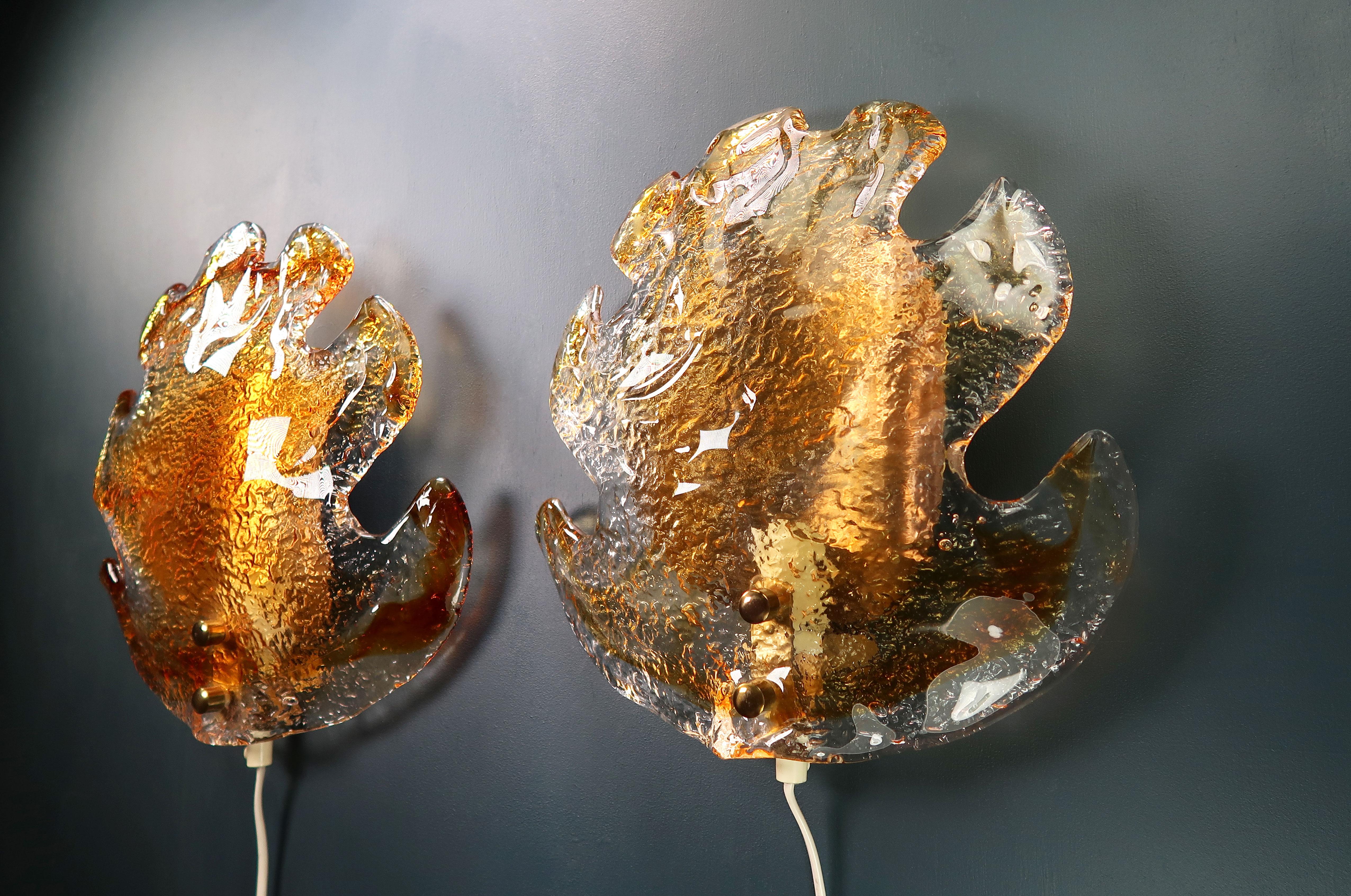 Dramatic Venetian Mid-Century Modern golden glass wall sconce organically shaped like a big autumn leaf. Golden colored Murano glass encased in clear glass with brass mount and details. Attributed to Carlo Nason and manufactured for the Mazzega