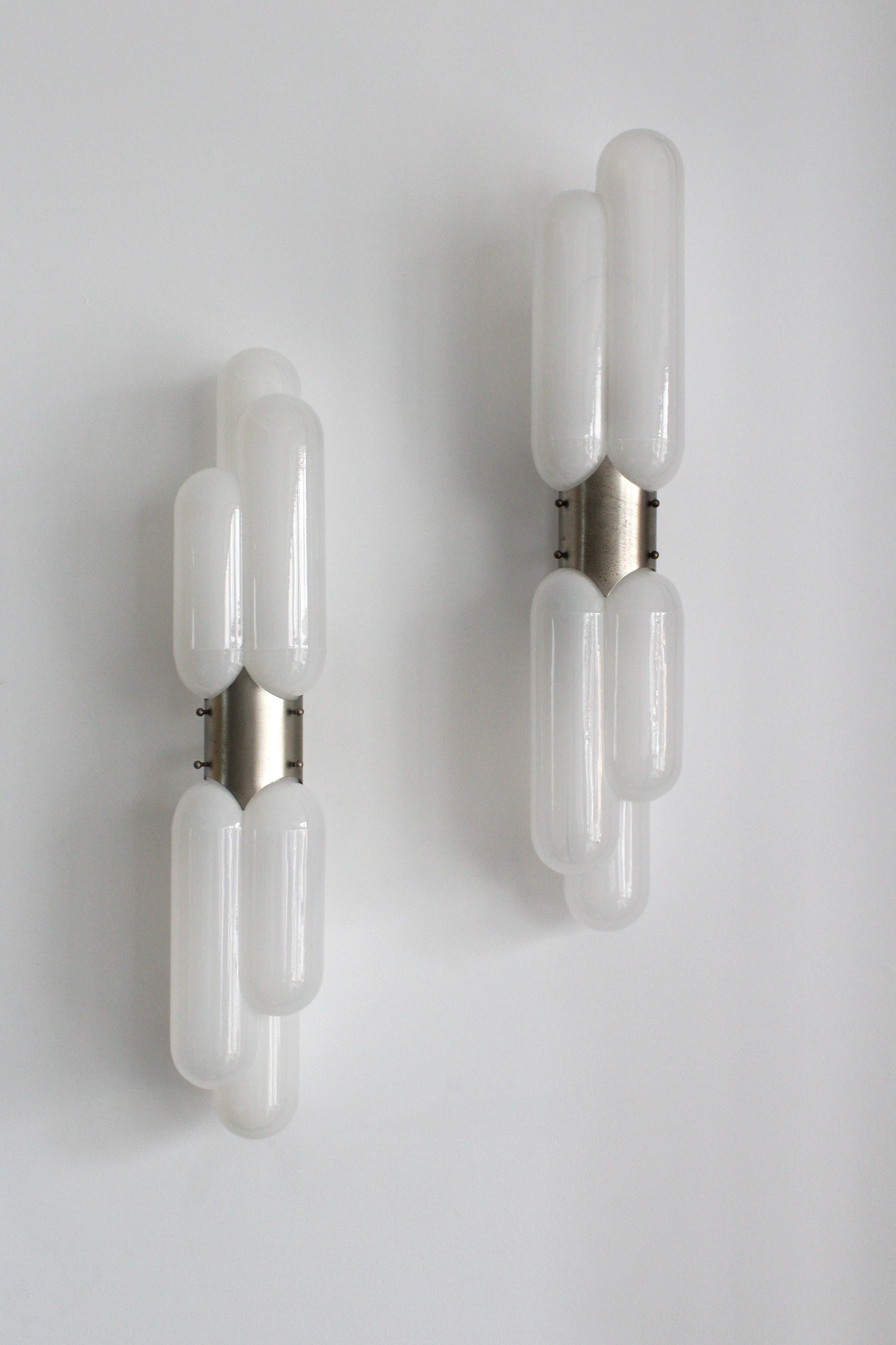 The Torpedo Wall Light by Carlo Nason is a stunning example of mid-century Italian lighting design, blending innovation with timeless sophistication. This iconic piece reflects Nason's mastery of Murano glass artistry and his forward-thinking