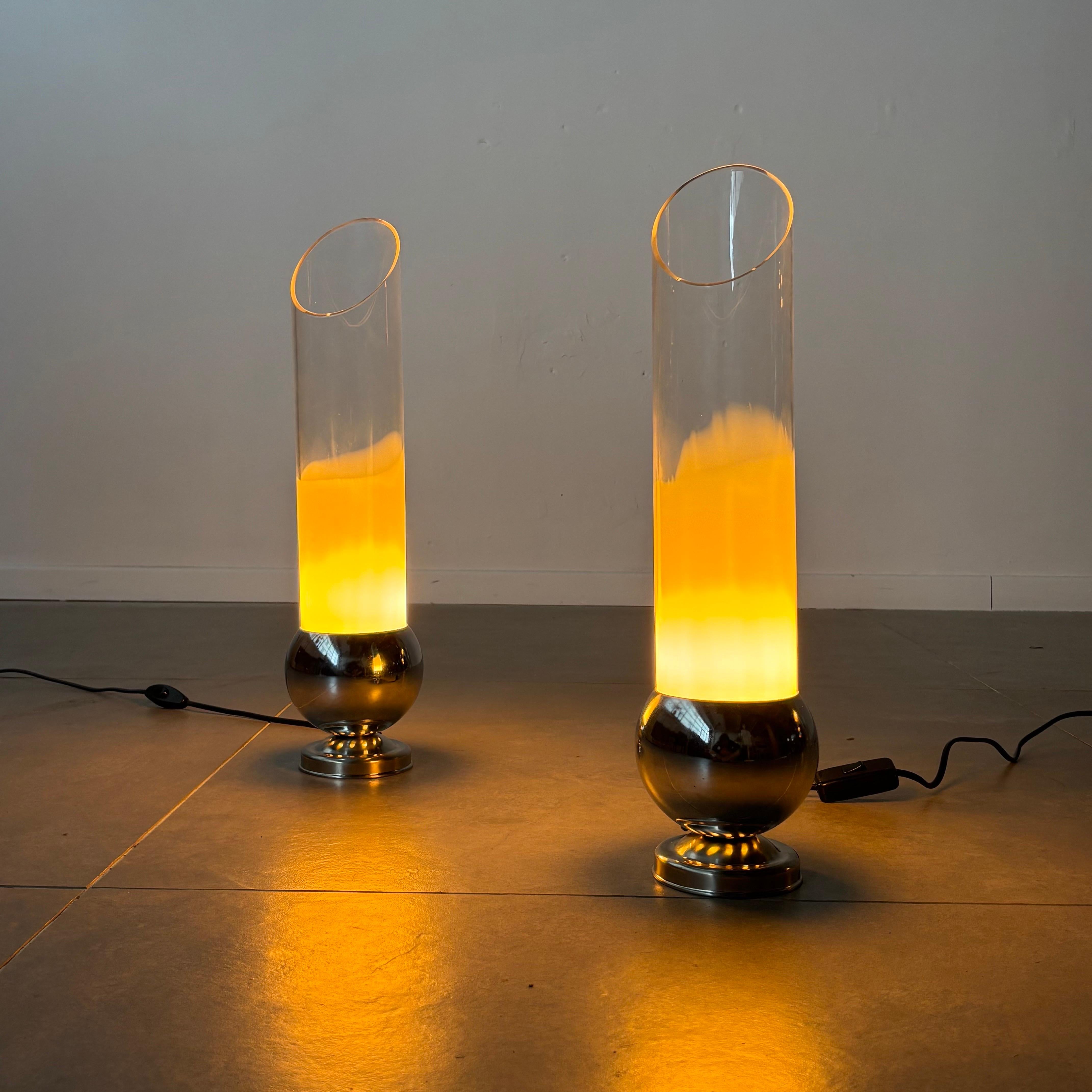 A pair of exquisite table lamps designed by the renowned Carlo Nason, showcasing his mastery of Italian glassmaking. Crafted in the 1970s, these lamps feature hand-blown tubular glass structures with a captivating half-transparent, half-opaque
