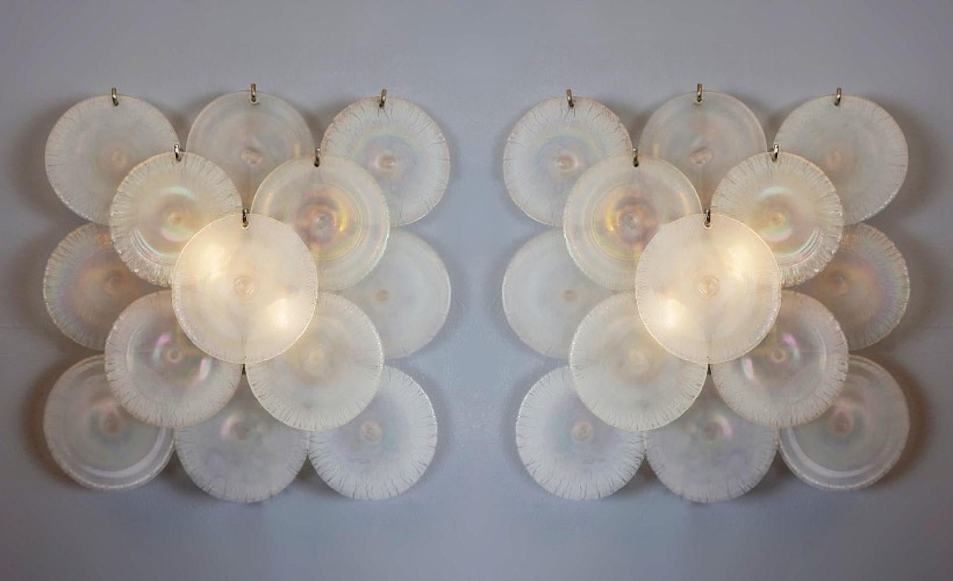 Pair of Carlo Nason wall lamps with murano glass discs - 1960s (2 pairs available).

The Italian designer Carlo Nason was born in 1935 in Murano, into a family of expert glassmakers. His father, Vincenzo Nason, ran the famous glass company