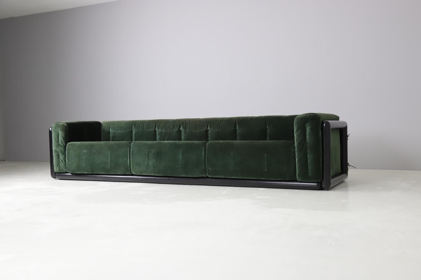 A unique pair of Cornaro sofas designed by Carlo Scarpa , Italy 1973. Made out of solid dark stained mahogany with original dark green velvet upholstery that stil has a very vibrant colour. The foam is perfect and the cushions are fixated to the