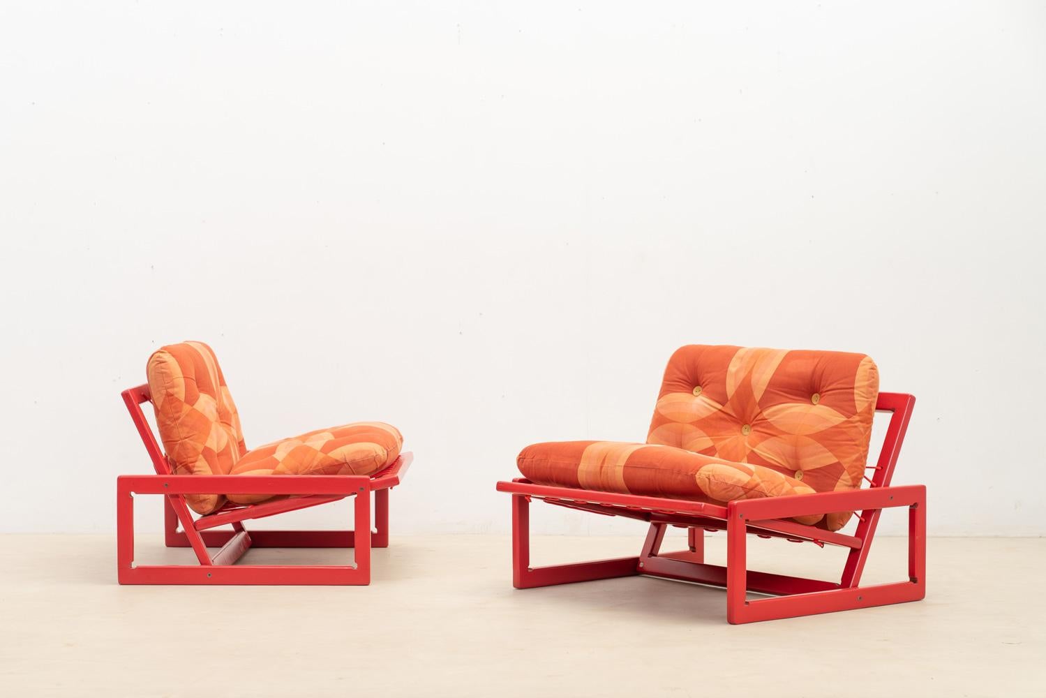 Set of two 'Carlotta' lounge chairs by Afra and Tobia Scarpa for Cassina. 
The minimalist structure features joined wood frames, providing a sturdy base for the two movable cushions. 

The chair is marked with an authentic label under the seat,