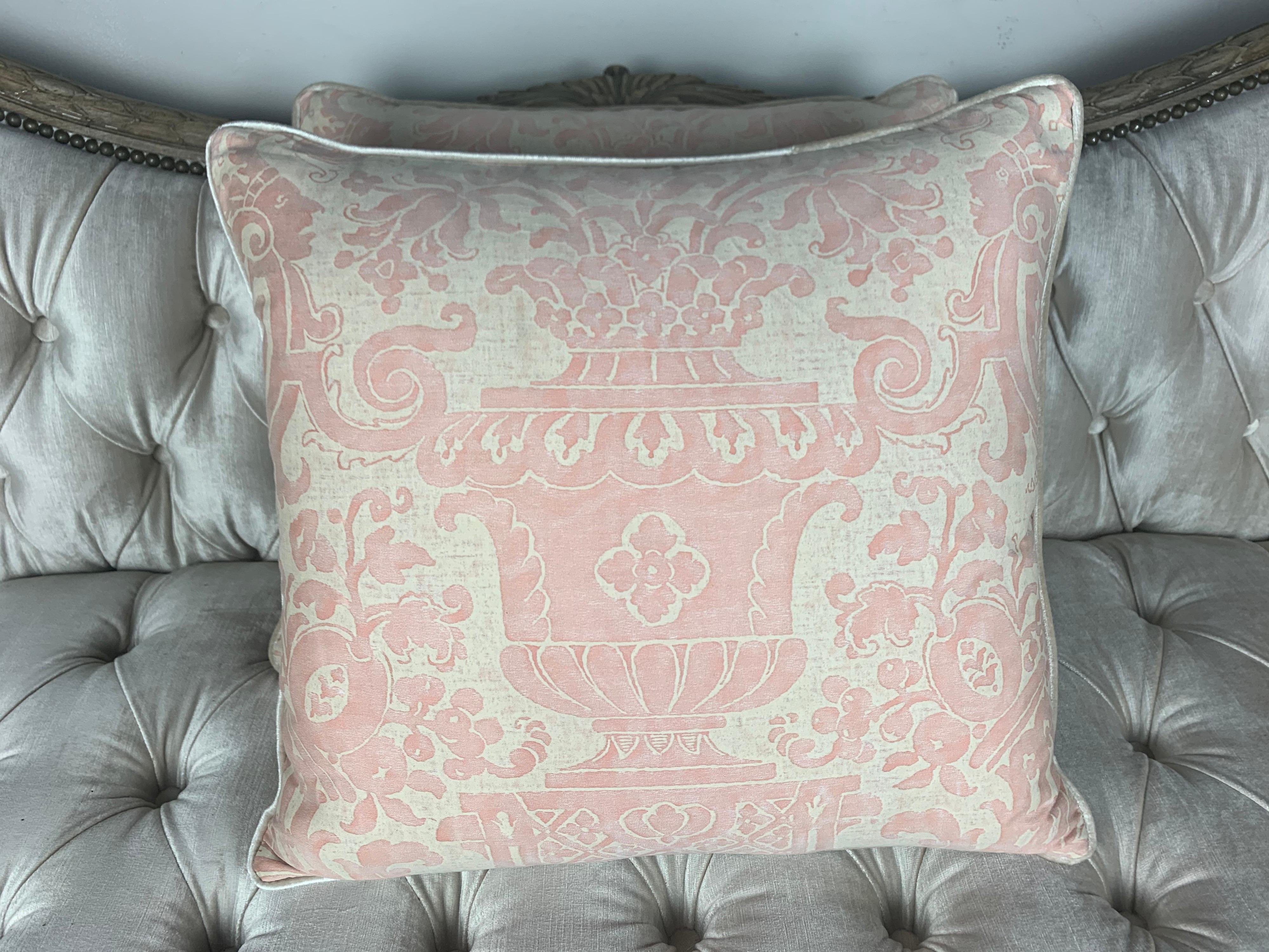 Pair of custom pillows made with authentic vintage Carnevalet patterned soft pink and white Fortuny textile fronts and silver colored velvet backs. Self cord detail. Sewn closed.