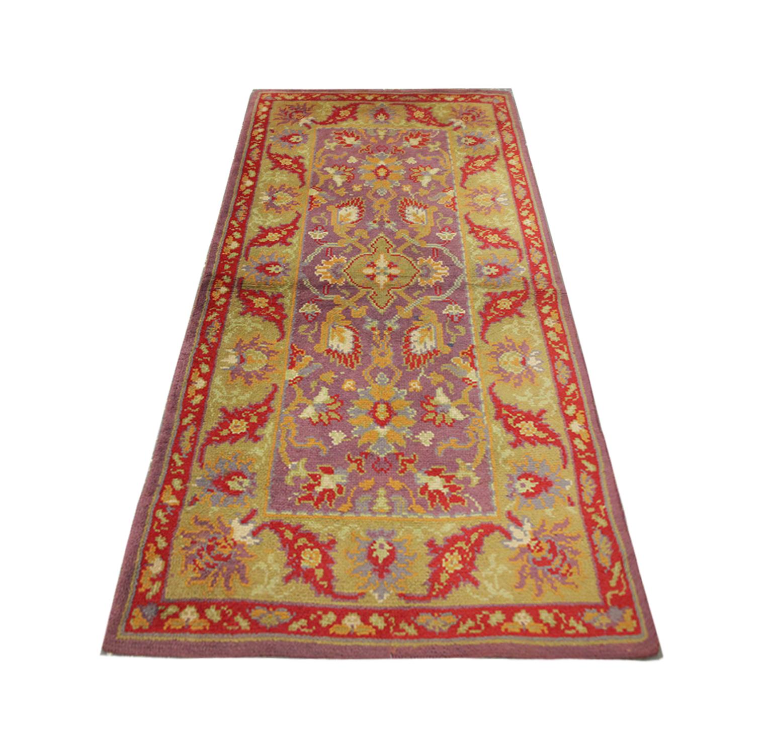 A Vibrant botanical design drenches these high-quality vintage British, Axminister rugs, with symmetrical floral motif designs, handwoven in 1980 with hand-spun, vegetable-dyed wool and cotton, by some of the finest British artisans. 
Perfect for