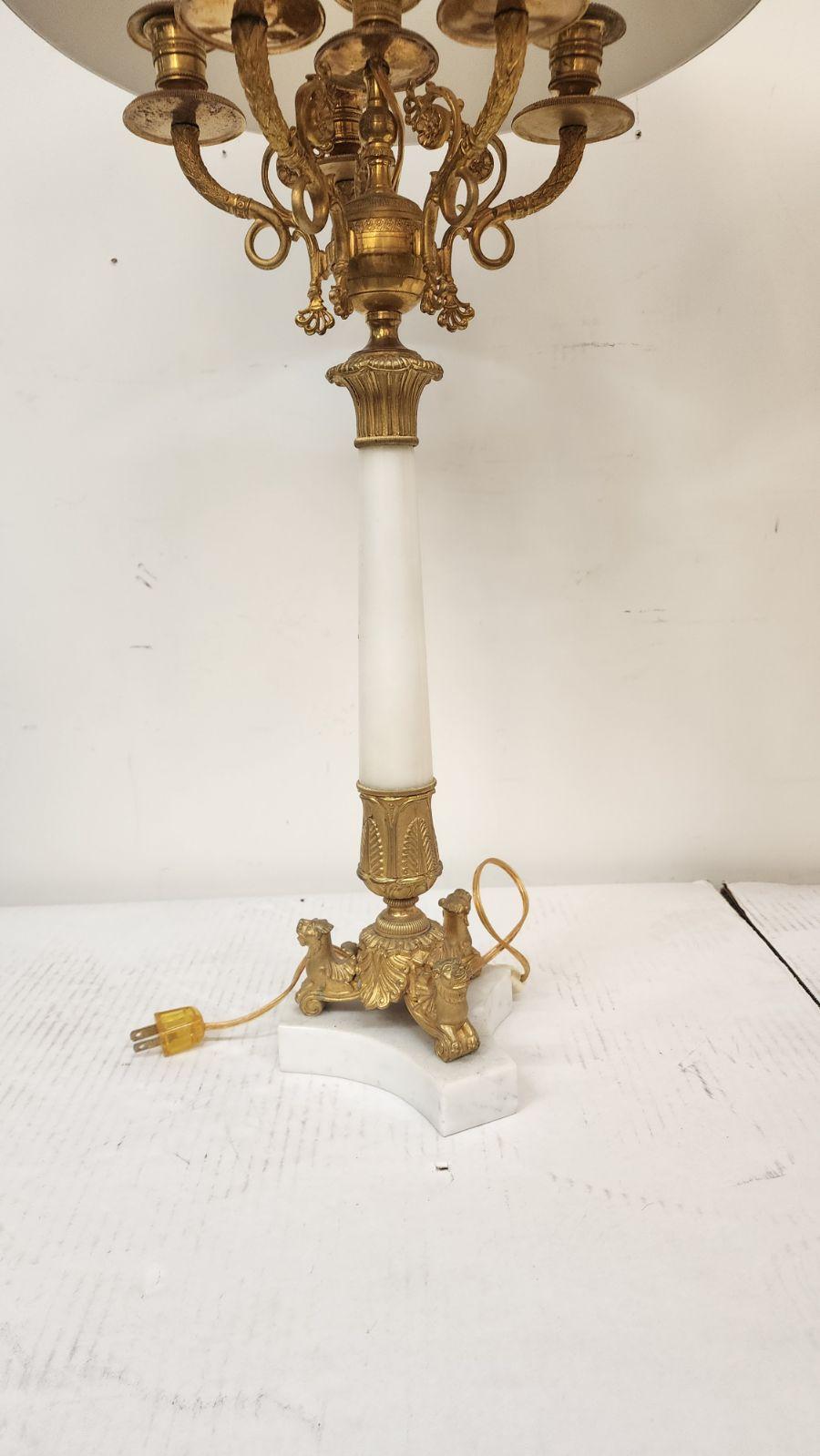 Pair of Empire period Carrara marble and gilt bronze candlestick lamps. 