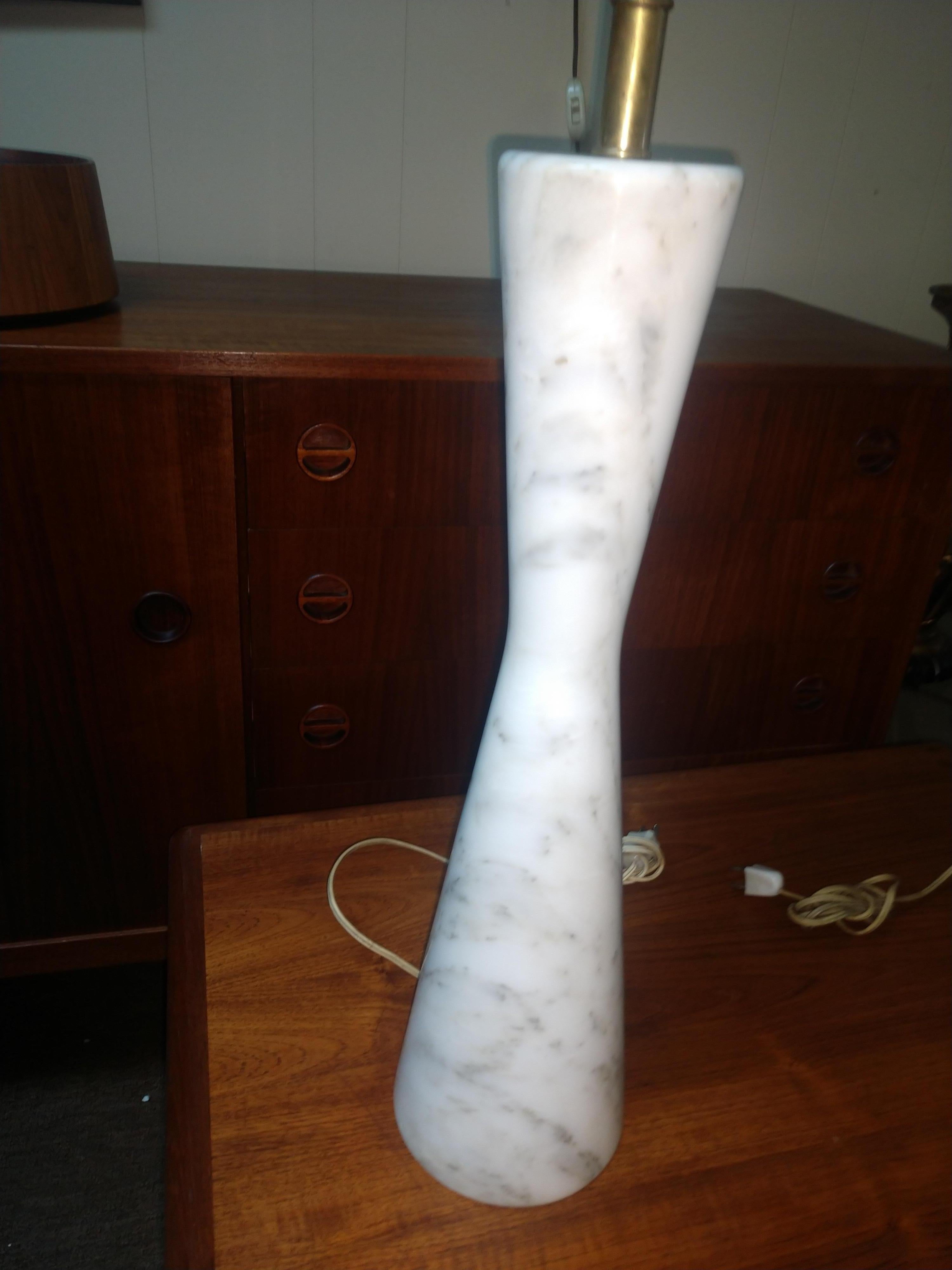 Fabulous and hard to find in an hour glass shape. Tall and slender 25 inch to the top of the socket by 5 3/8 diameter at the base. In excellent vintage condition with no chips or cracks to marble. Original wiring which is sound, harps are