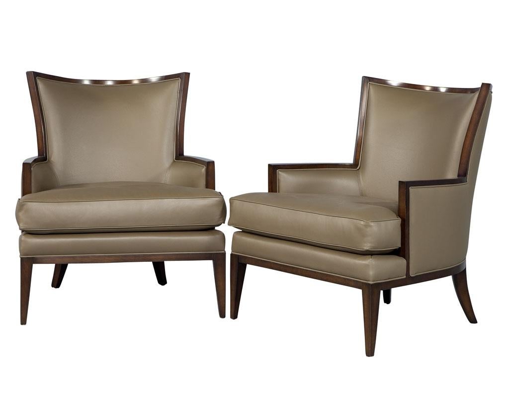 Comfort is king with these Carrocel custom leather modern wingback armchairs. These chairs feature a modern and sleek look, inspired by a design that withstood the test of time. These chairs are finished in a butter soft taupe leather with a loose
