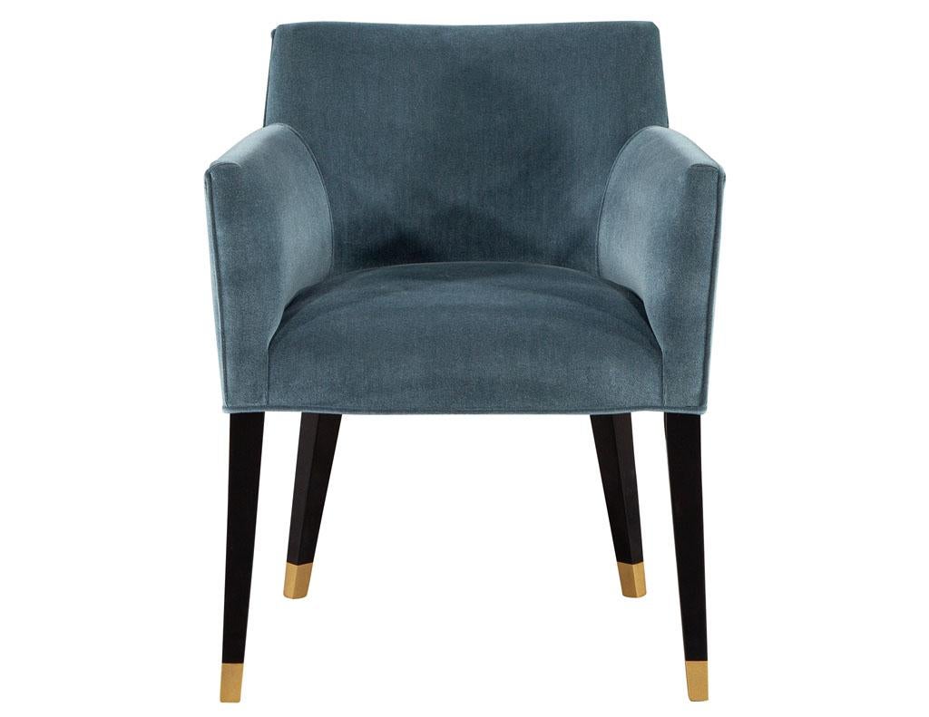 Pair of Carrocel custom Tonio dining chairs with golden accents. Featuring soft indigo blue velvet with hand painted gold accents on feet. Price includes complimentary curb side delivery to the continental USA.
