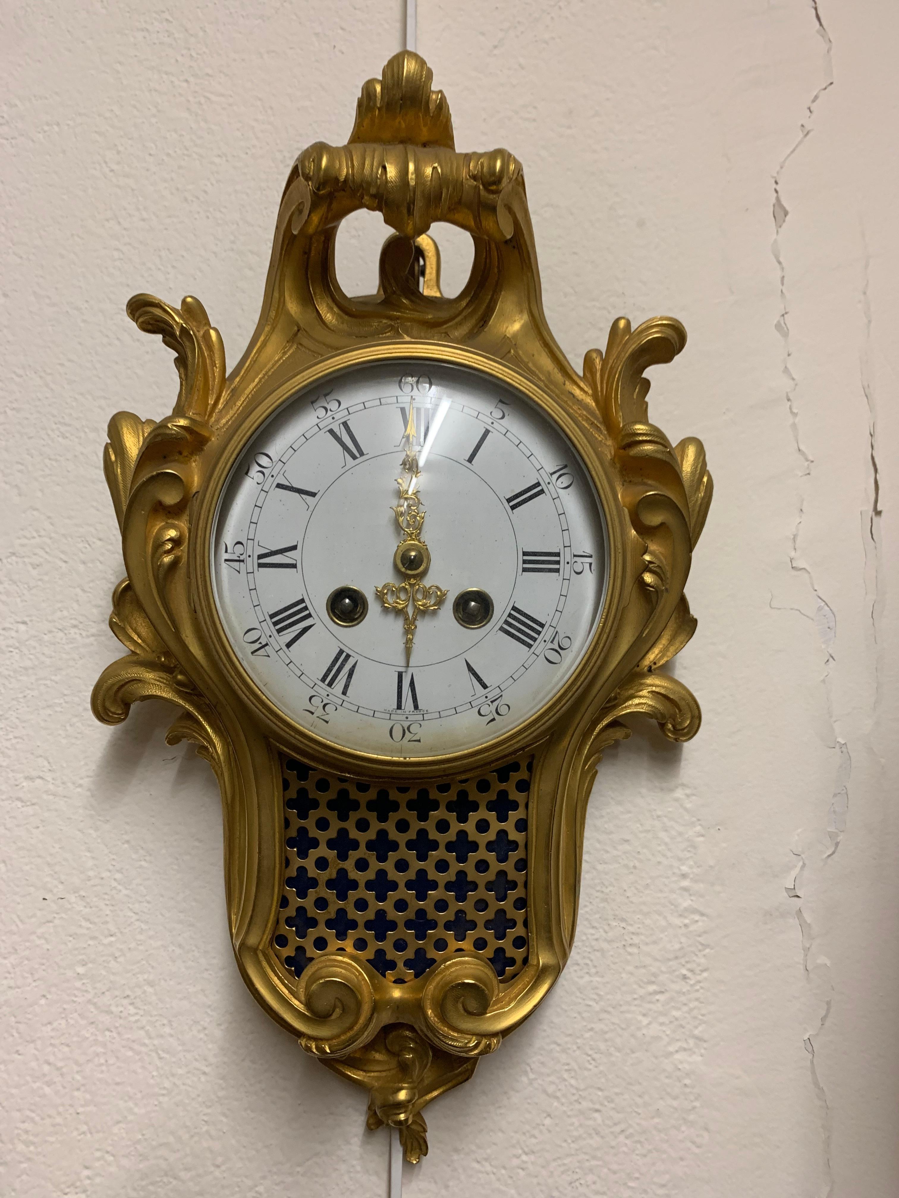 A very fine pair of bronze cartel and barometer in louis XV style 
the both case is exuberantly embellishedwith scrolling work of the louis XV style,the both faces are in enamel.