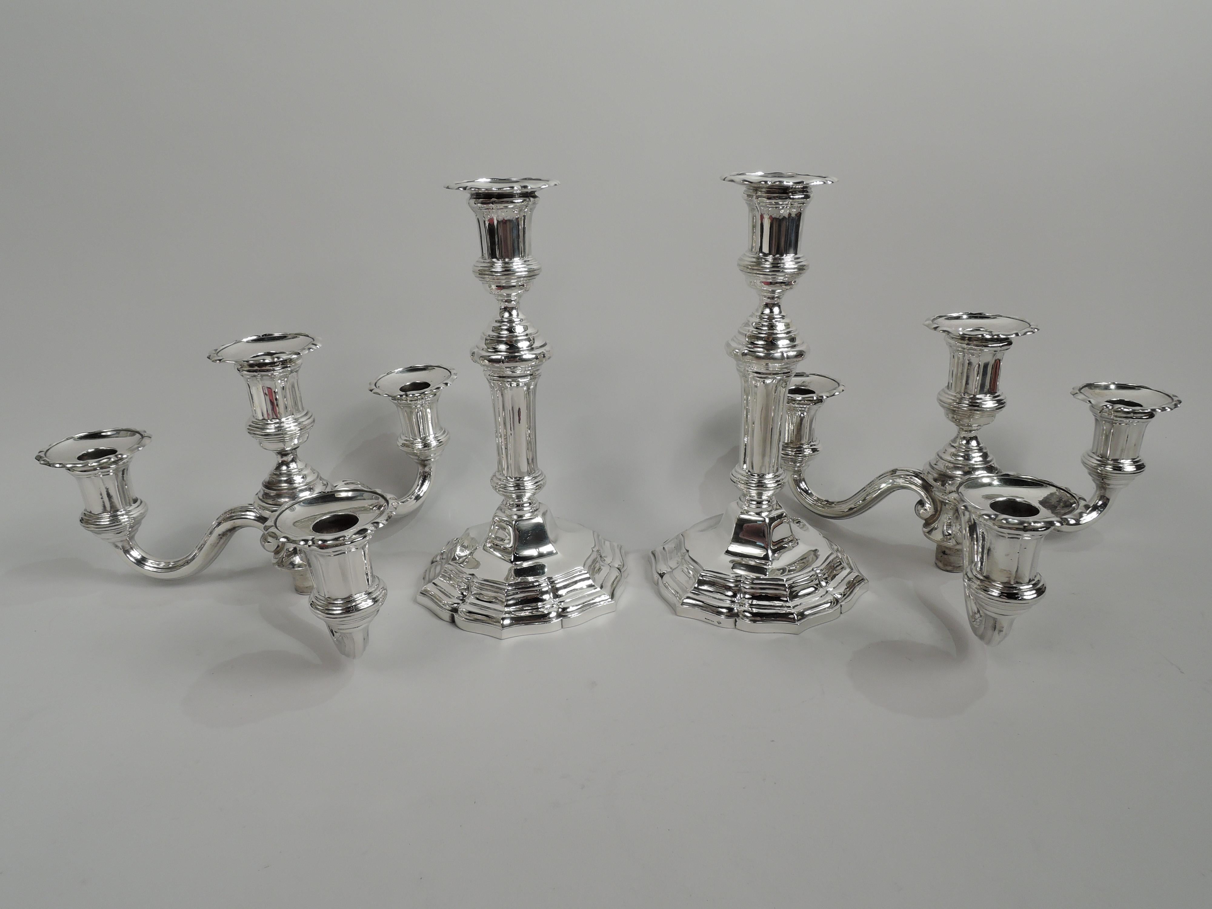 Pair of modern classical 950 silver 5-light candelabra. Made by Tetard Frères in France, ca 1920, for Cartier. Each: Fluted shaft with stepped and reeded knops; foot stepped with ogee-scroll rim. Three reeded s-scroll arms, each terminating in