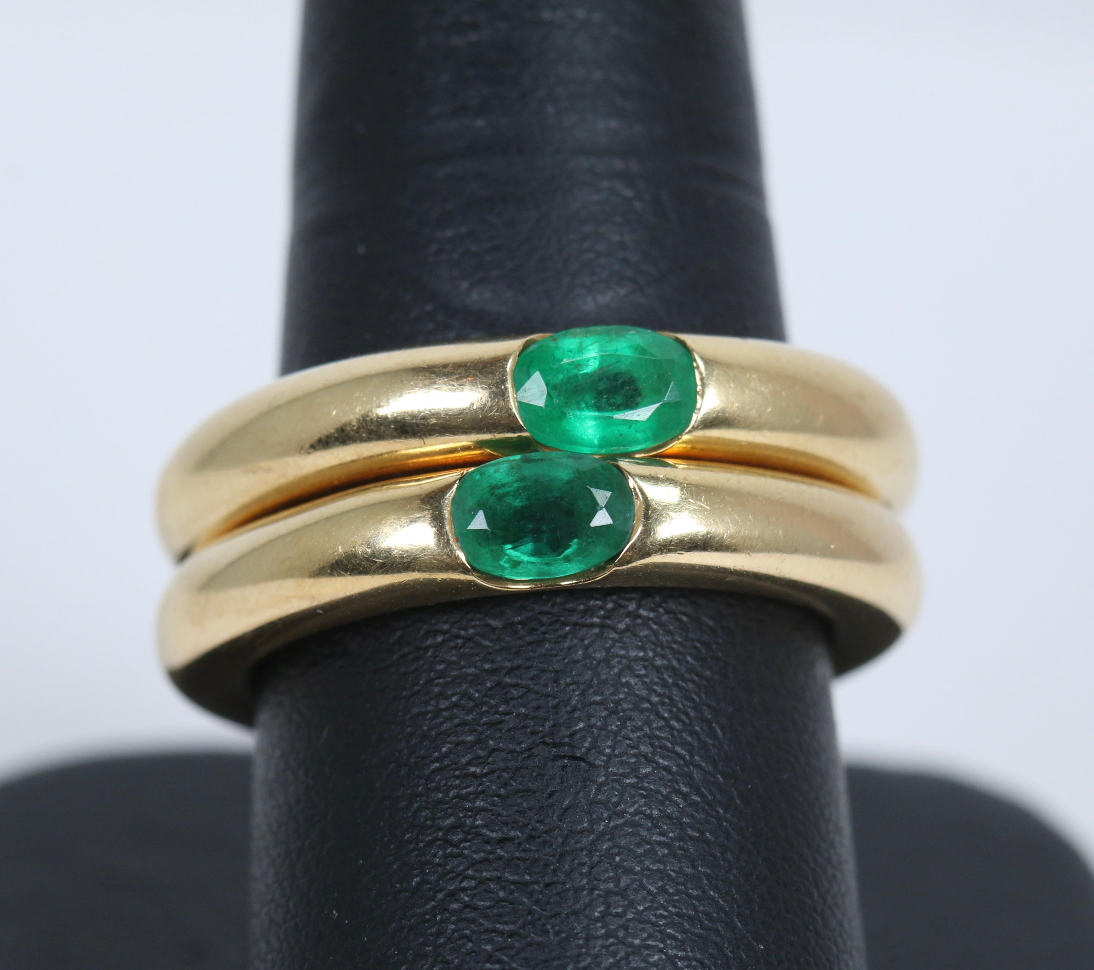 Modern Pair of Cartier Yellow Gold Bands with Single Emeralds