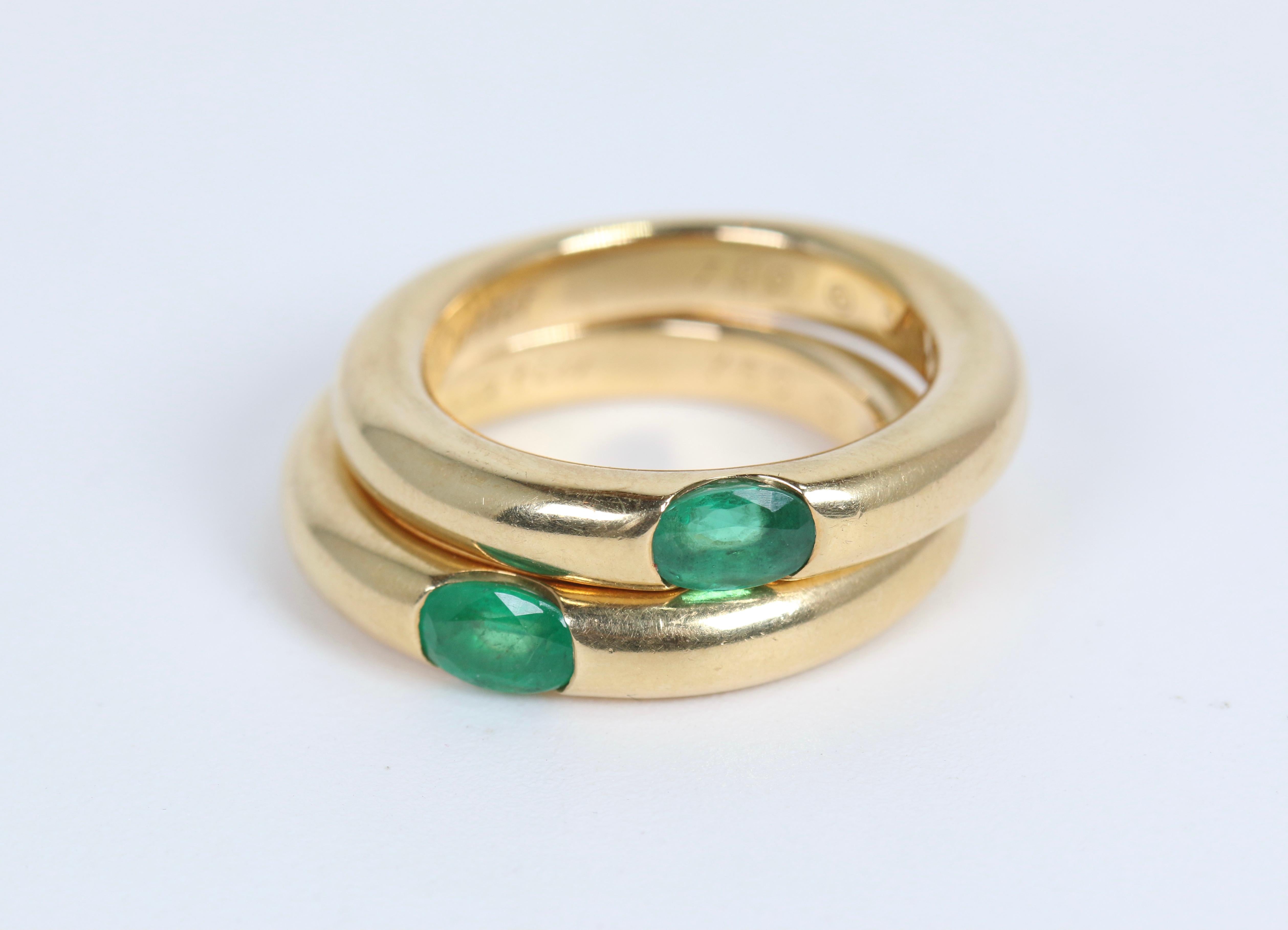 Pair of Cartier Yellow Gold Bands with Single Emeralds In Good Condition In Dallas, TX