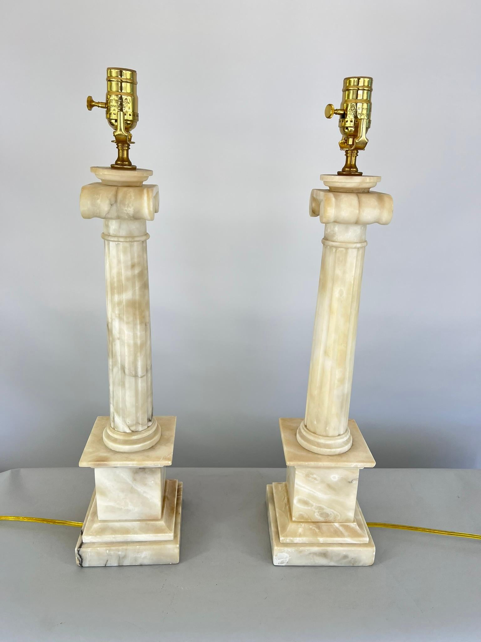 Neoclassical Pair of Carved Alabaster Columnar Lamps with Ionic Capitals For Sale