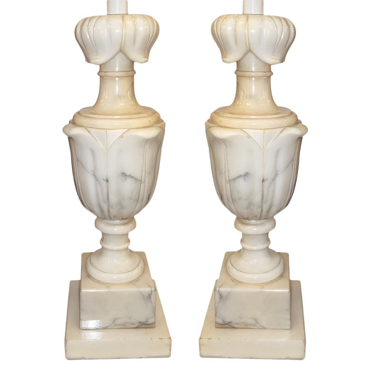 A pair of circa 1920s Italian carved alabaster table lamps with foliage design.

Measurements:
Height of body 14