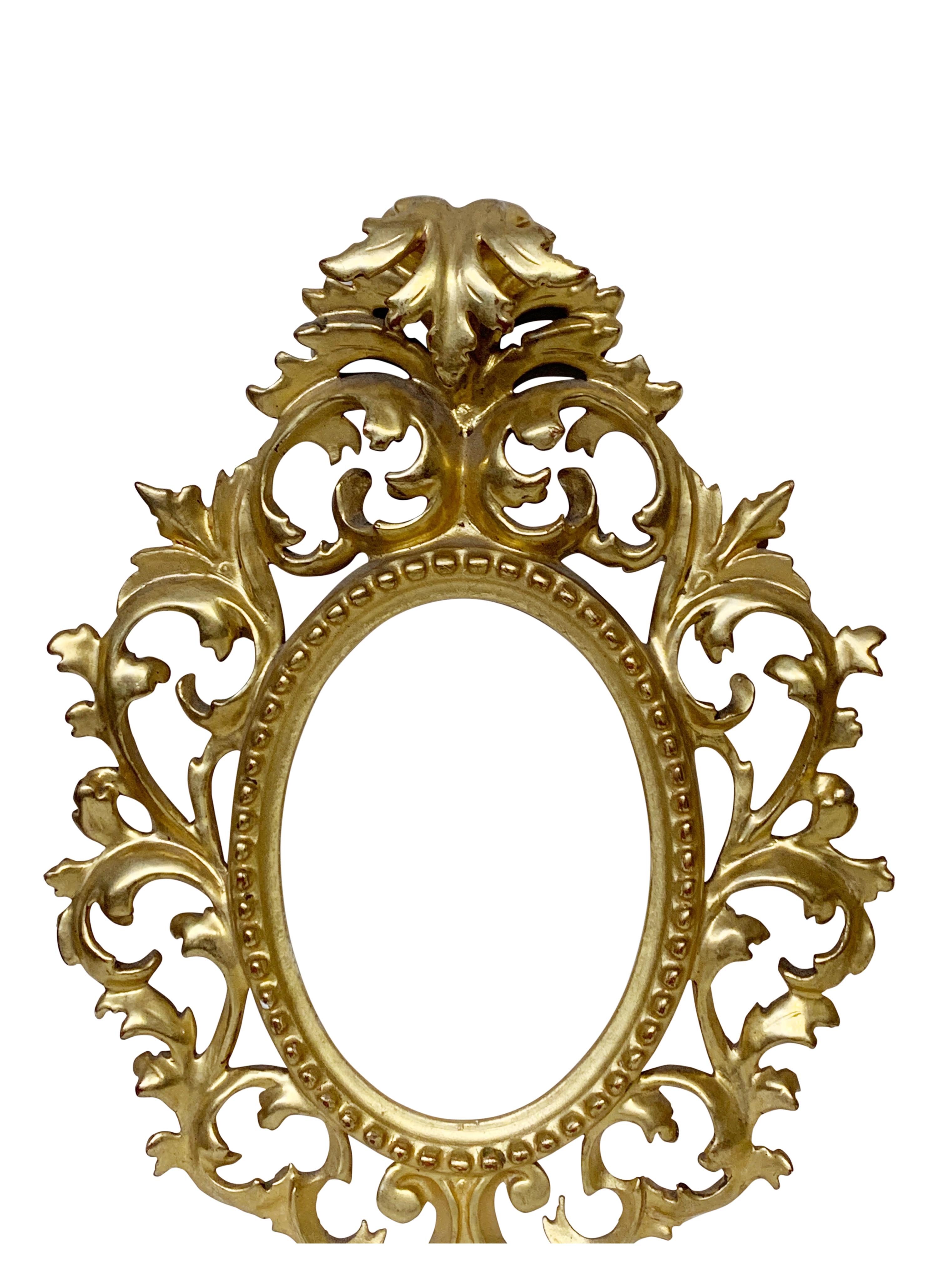 Rare pair of Venetian carved and gold leaf frames for oval porcelain plaques/ Net size is approximately 4