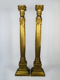 Pair of carved and gilded wooden columns decorated with cherubs, 19th-century