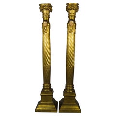 Pair of carved and gilded wooden columns decorated with cherubs, 19th-century