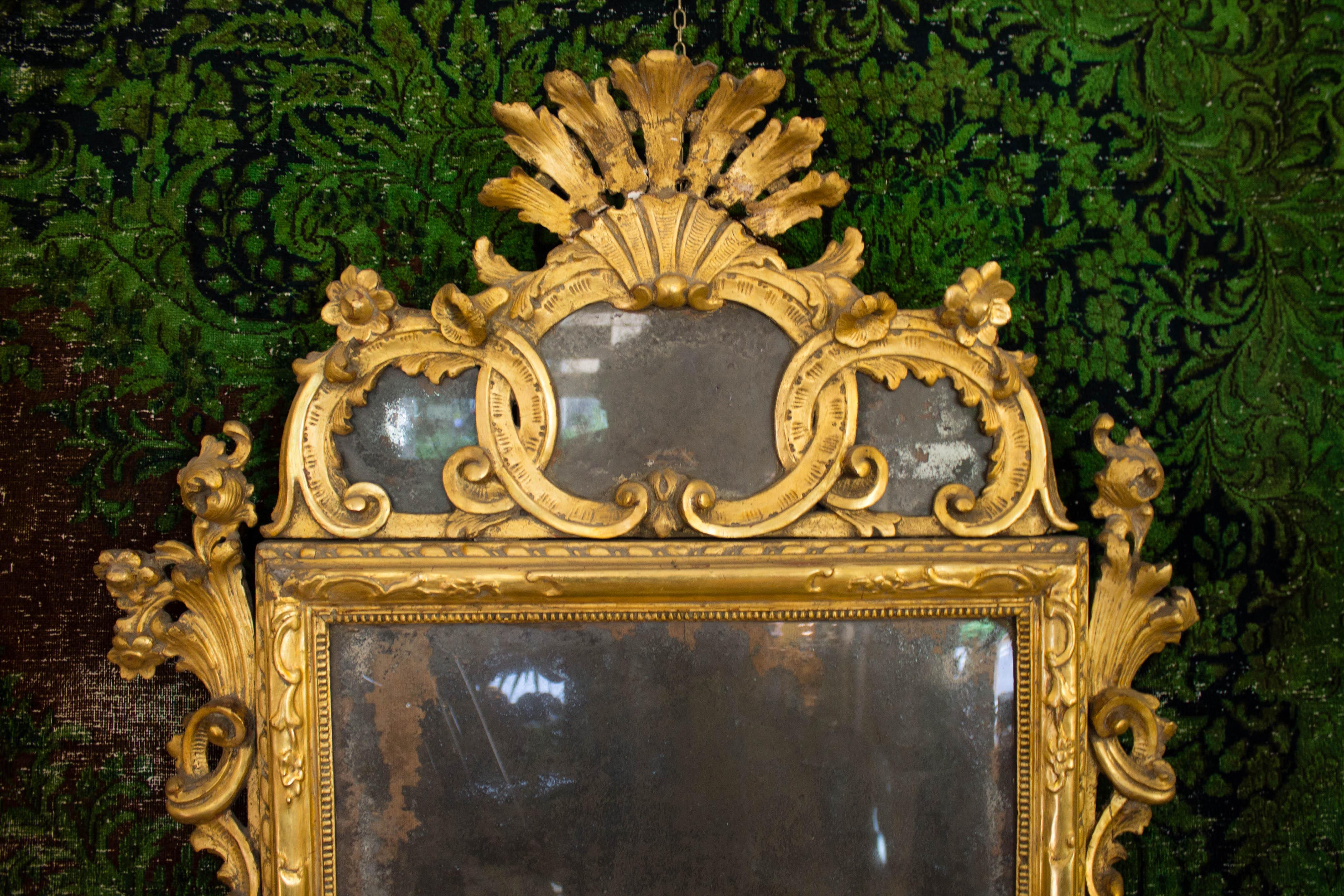Pair of carved and gilded wooden mirrors from the 18th century made in Sicily
Mirror carved and gilded finely gold leaf Louis XV era '700 mirror to the original mercury. gilding is a process of ornamental decoration used on different materials and