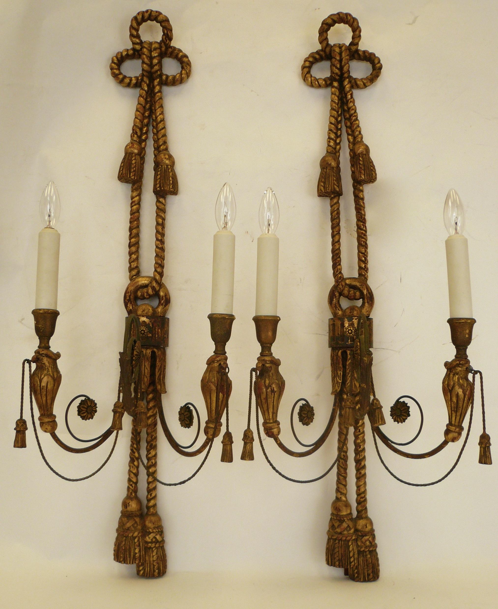 These handsome sconces are beautifully made, and feature rope carved bowknots and tassels,.