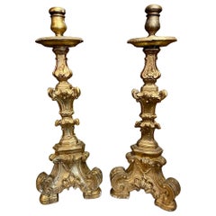 Pair of Carved and Parcel Gilt Altar Sticks