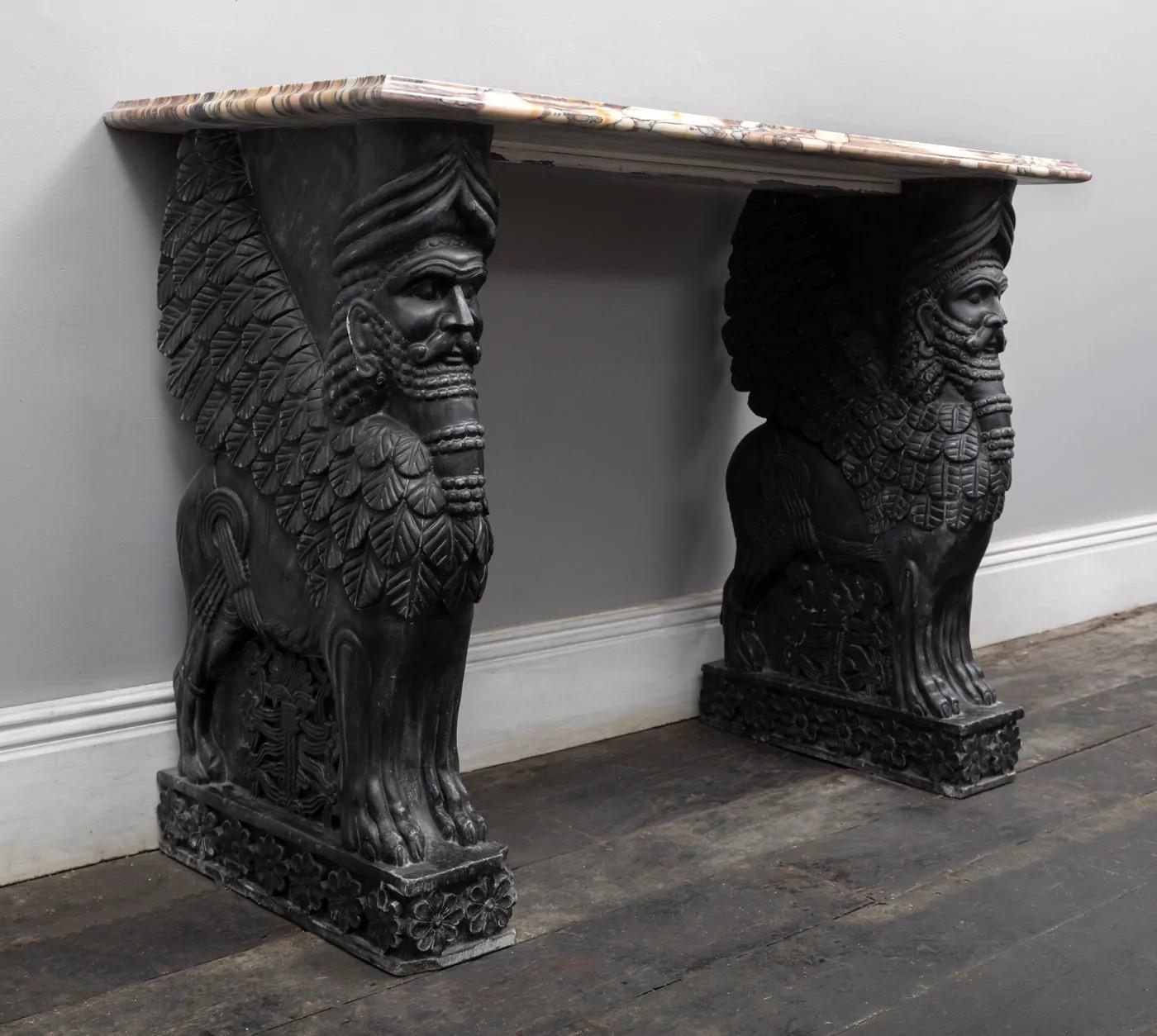 Revival Pair of carved black marble and coloured Medicea Siena marble topped console's For Sale