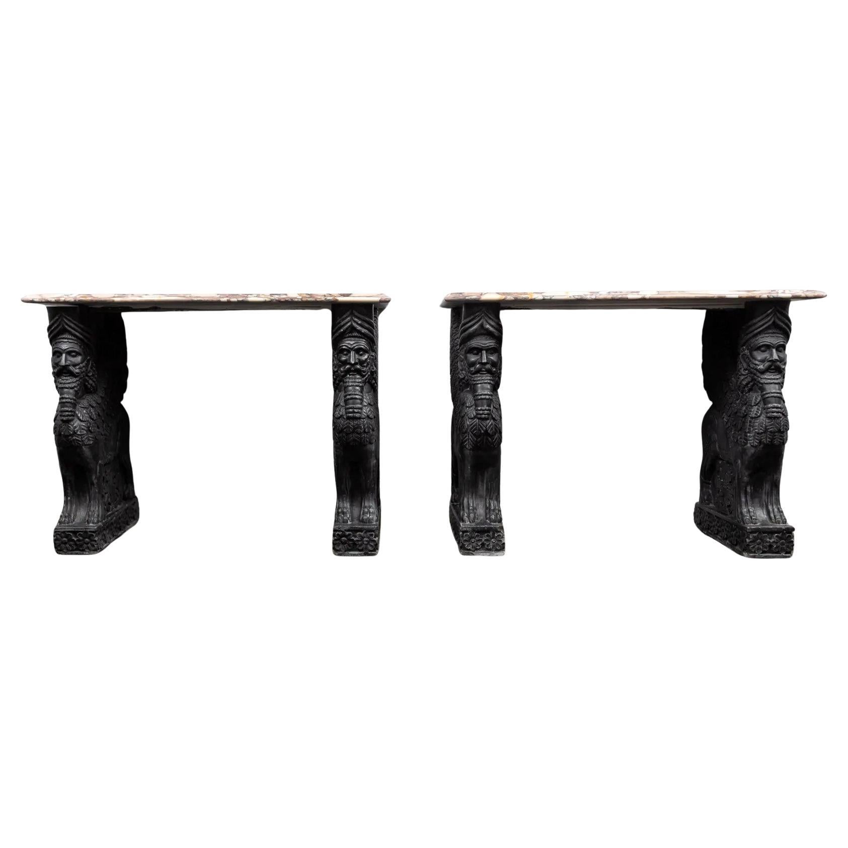 Pair of carved black marble and coloured Medicea Siena marble topped console's For Sale