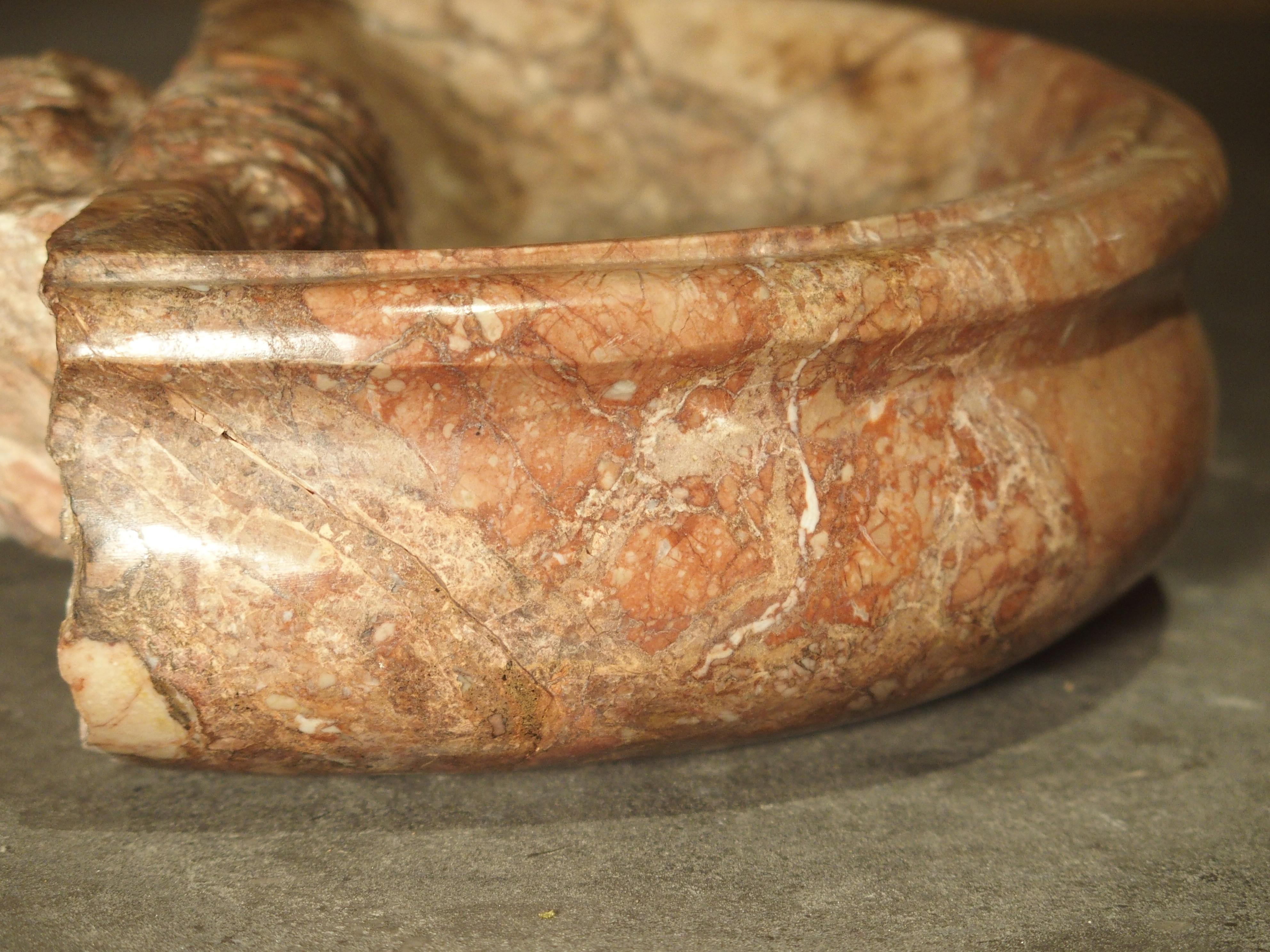 These versatile Italian Breccia Pernice marble basins are just over 10 inches wide and completely hand carved and polished. Marble basins of this size were usually used in a church as holy water vessels. There are stylized acanthus leaf motifs at